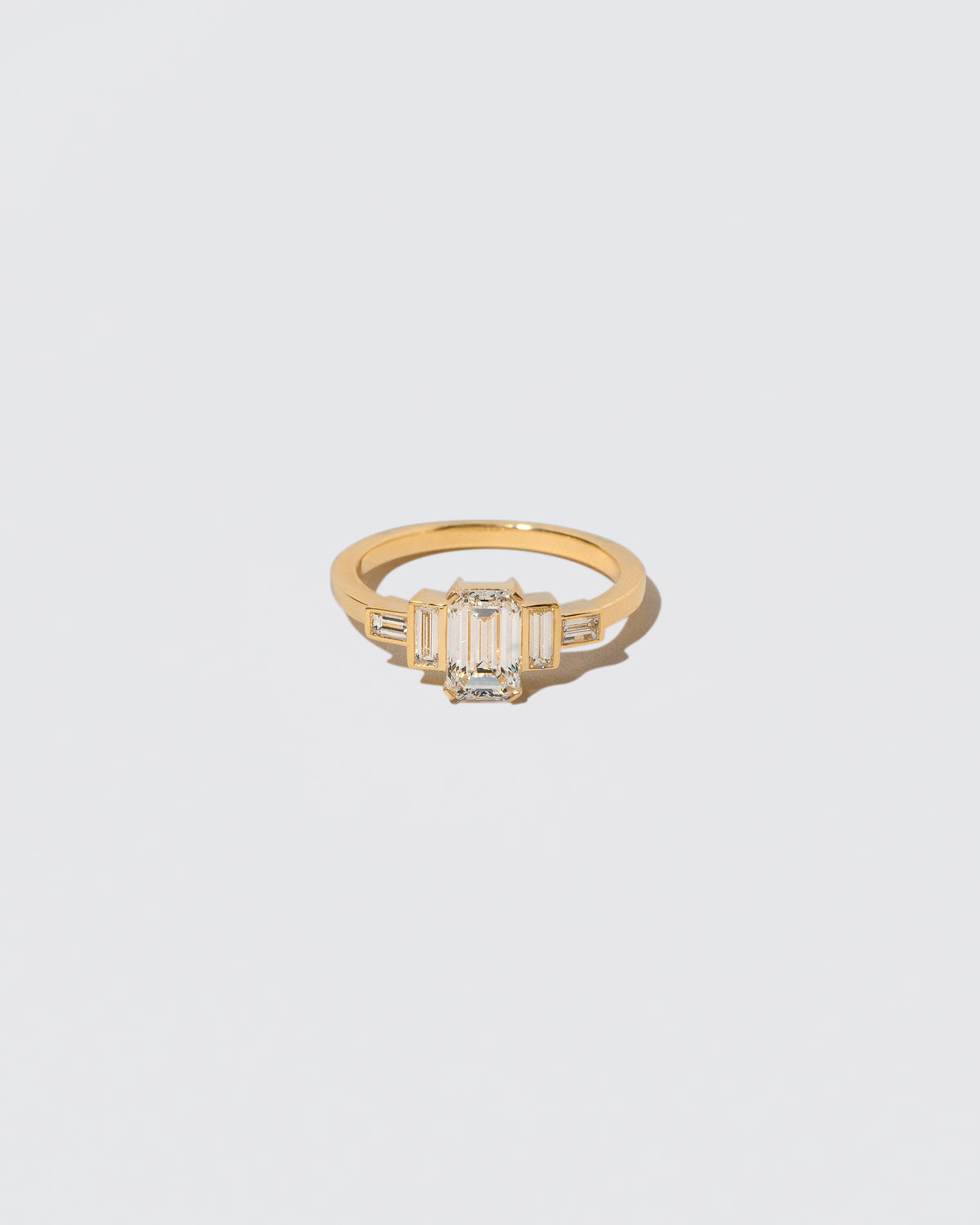 Diamond Assertion Ring on light color background.