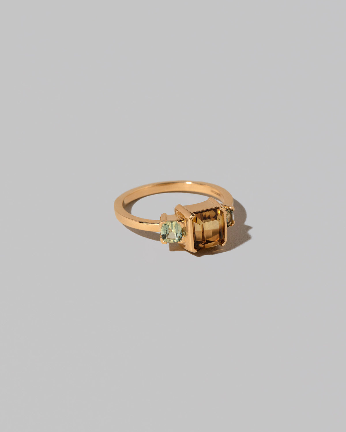 View from the side of the Brassia Ring on light color background.