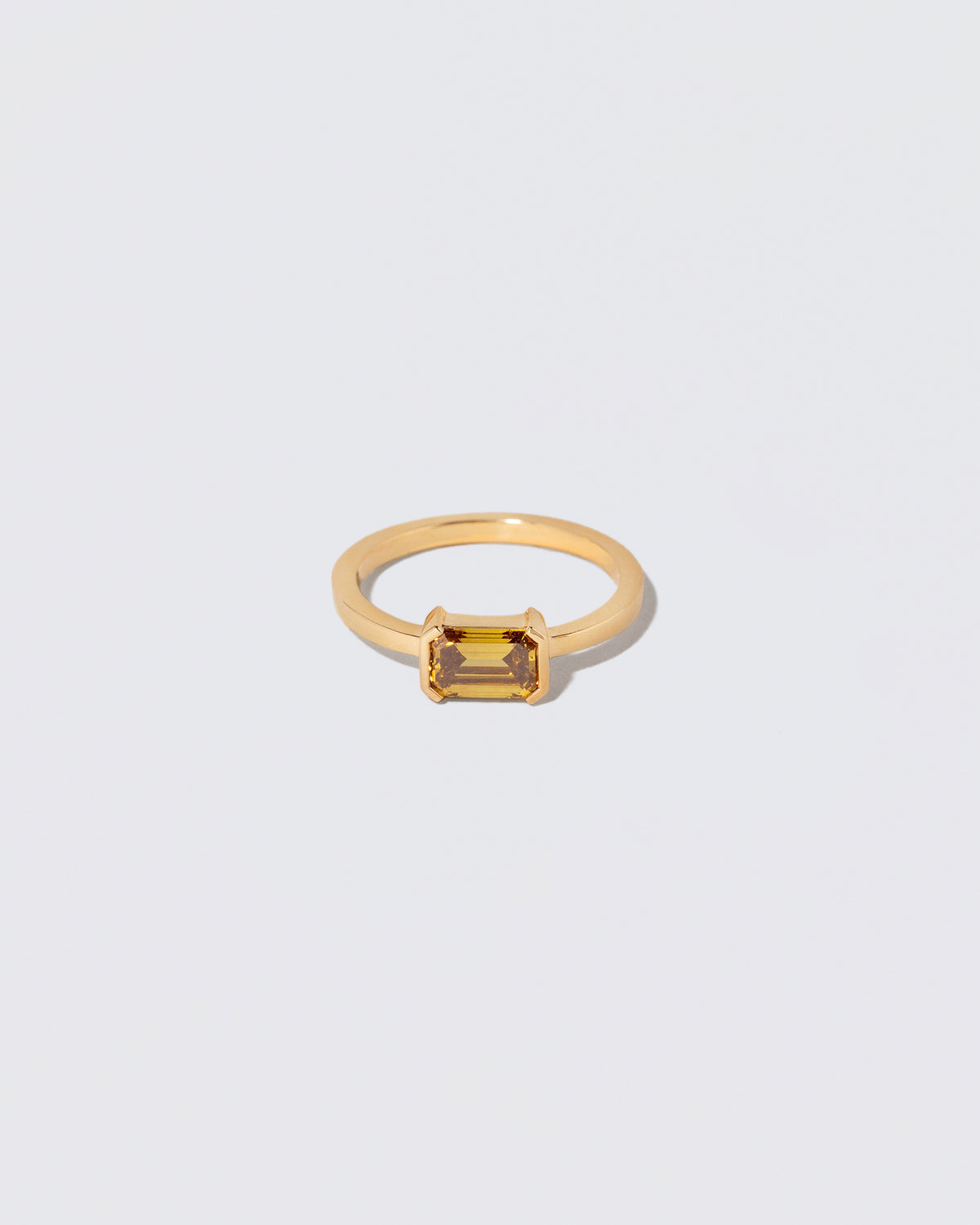 Brown Diamond Courtship Ring on light color background.