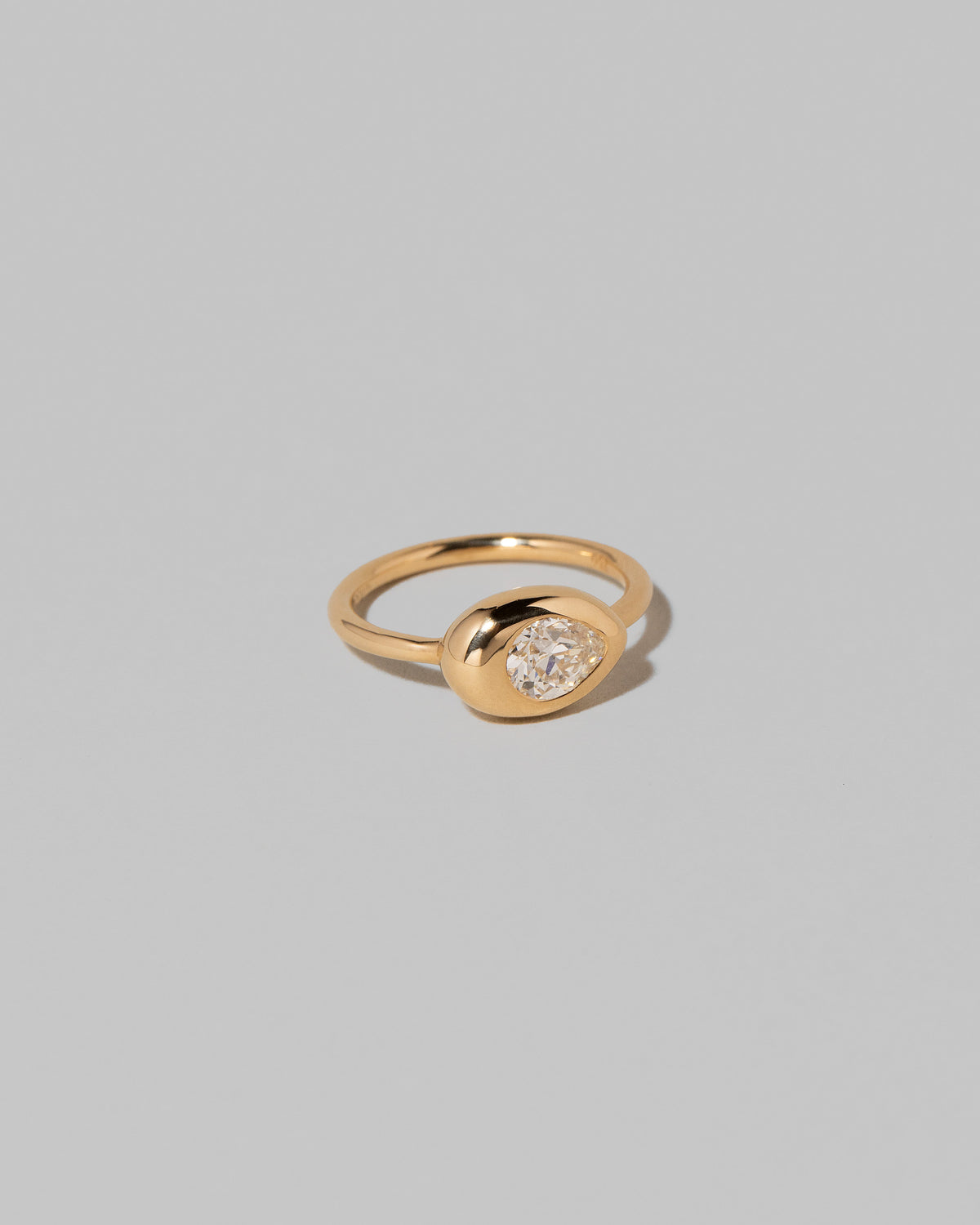 View from the side of the Diamond Align Ring on light color background.