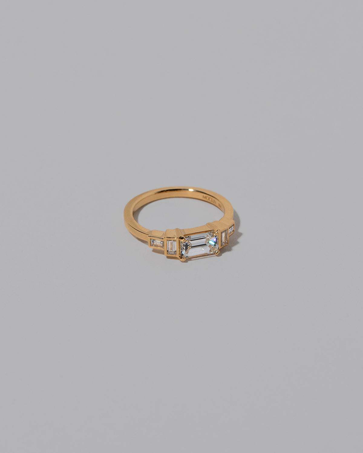 View from the side of the Diamond Expression Ring on light color background.