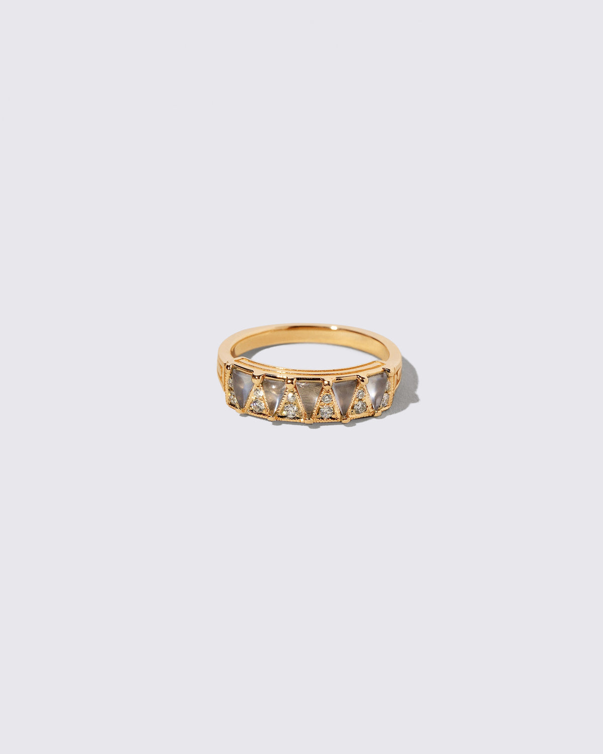 Gold Blue Chalcedony Five Triangle Ring on light color background.