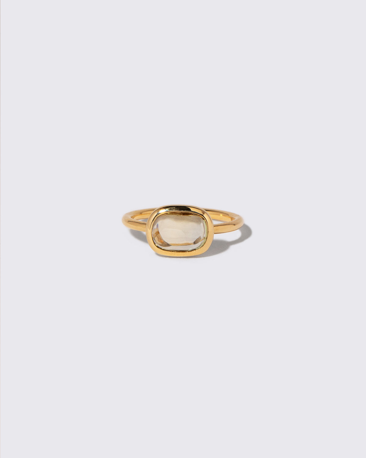 Green Sapphire Gusher Ring on light color background.