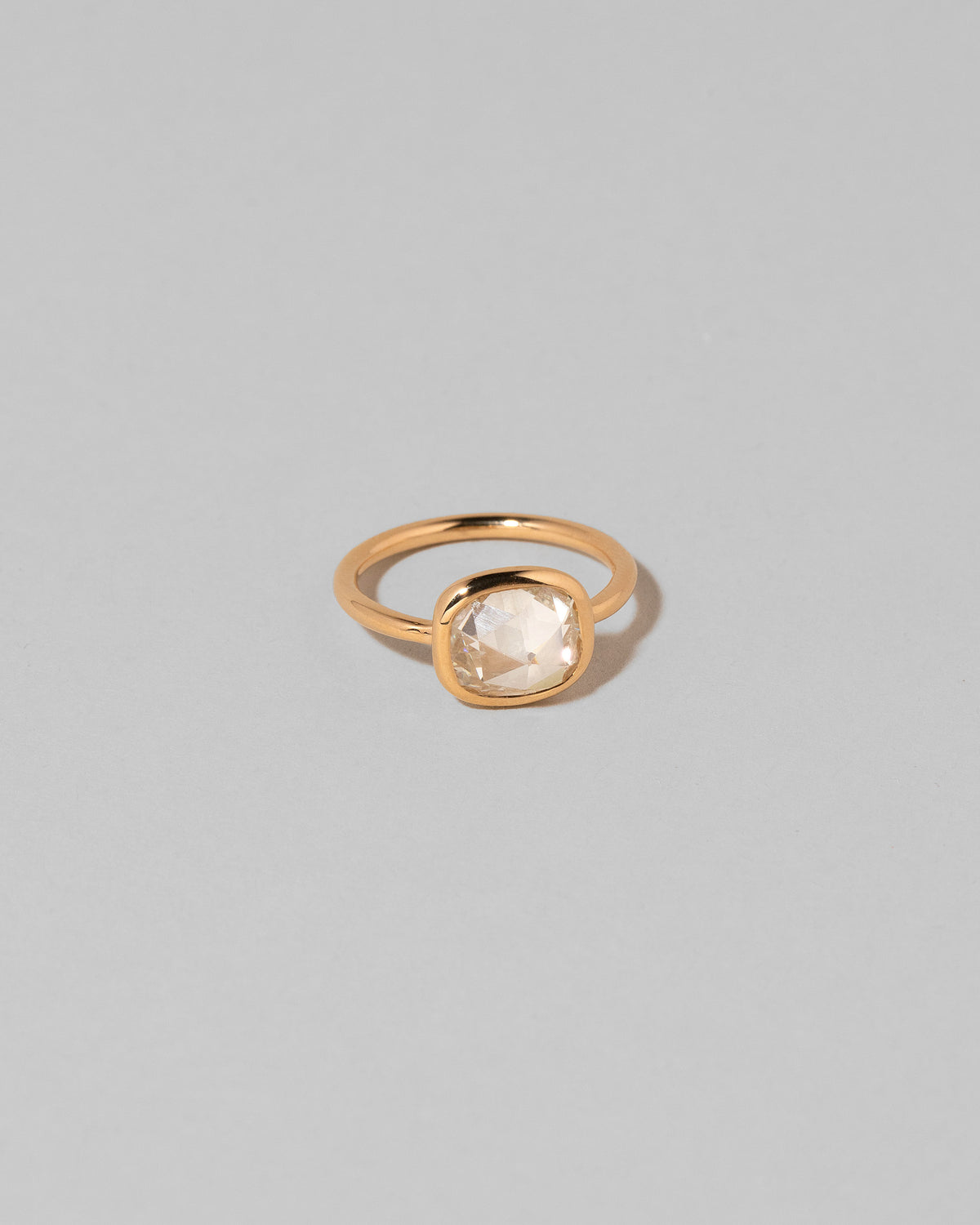 View from the side of the Gusher Diamond Ring 006 on light color background.