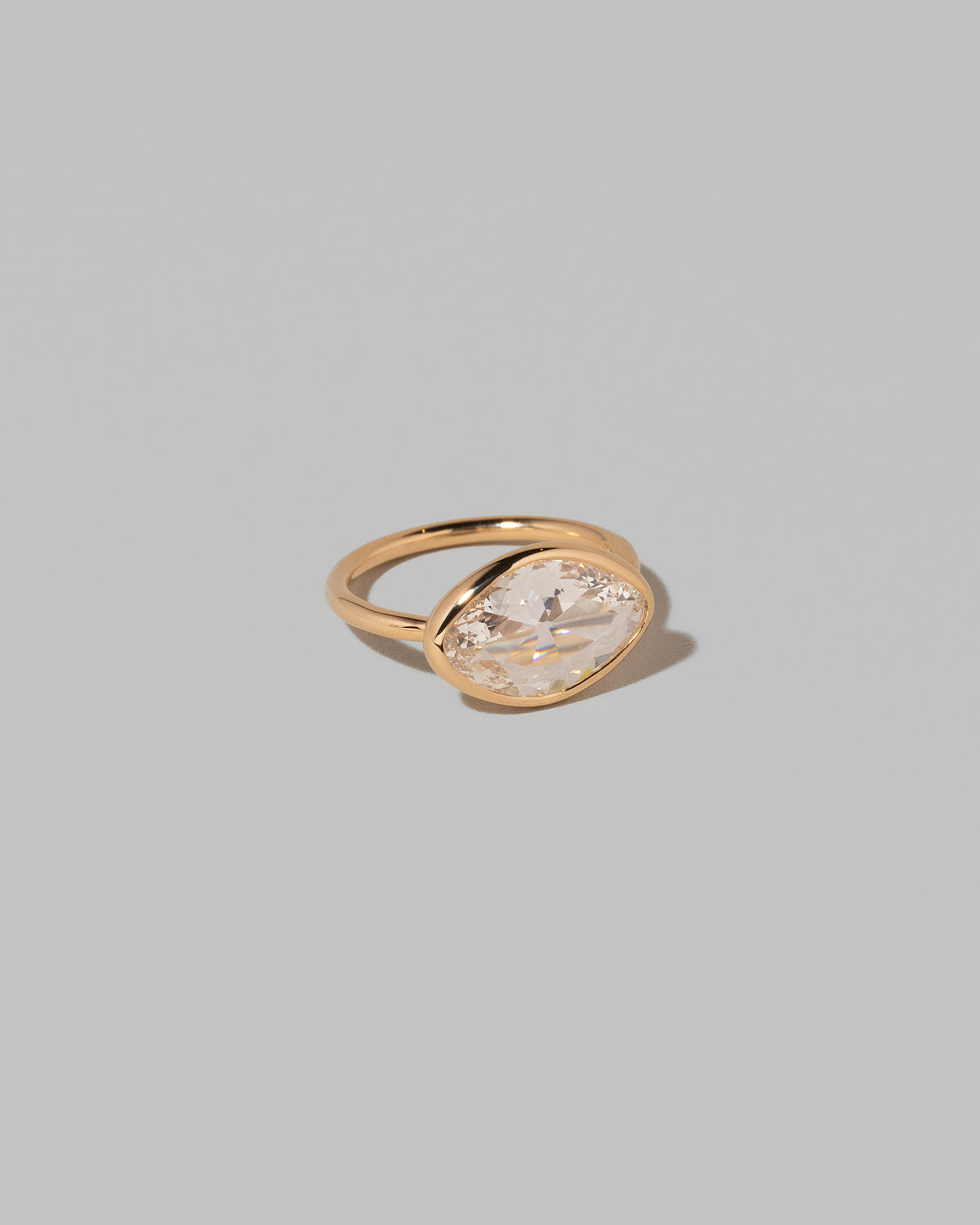 View from the side of the Gusher Diamond Ring 007 on light color background.