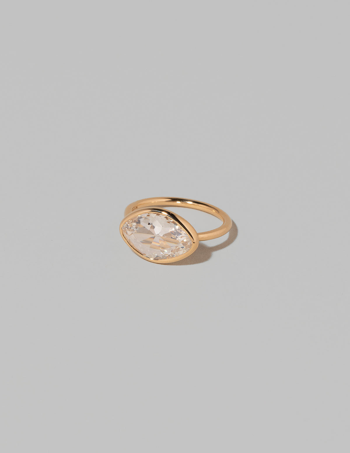 View from the side of the Gusher Diamond Ring 007 on light color background.