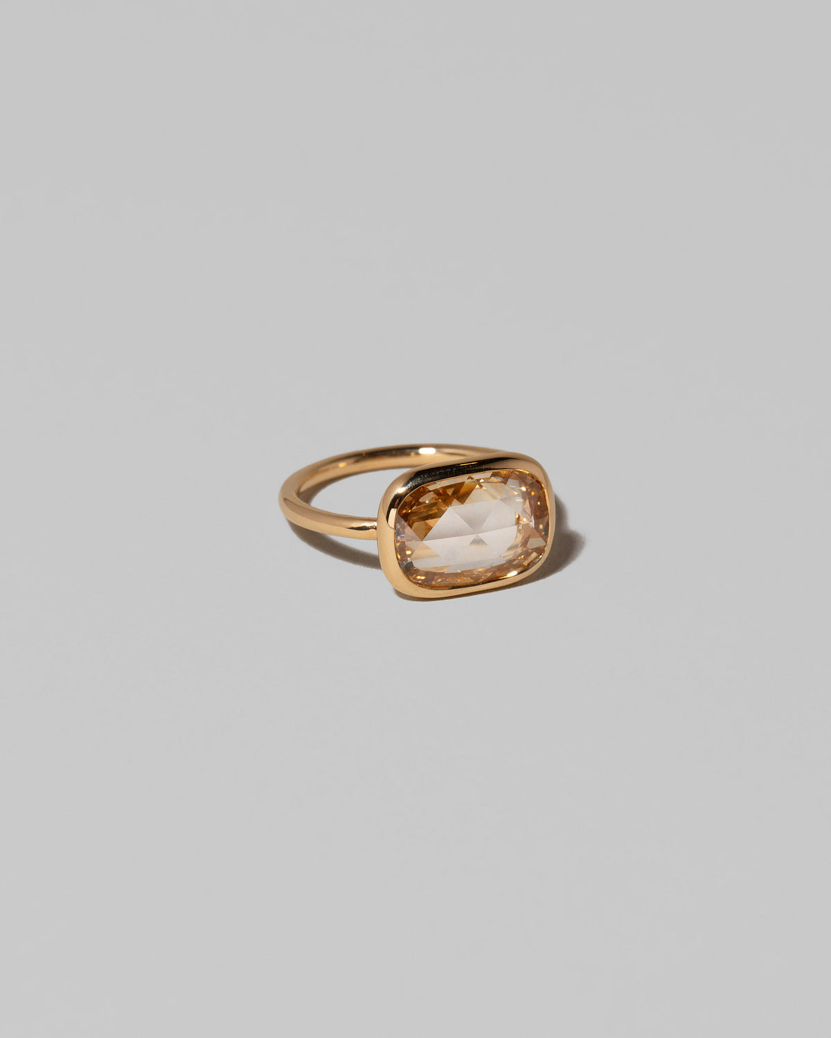 View from the side of the Gusher Diamond Ring 013 on light color background.