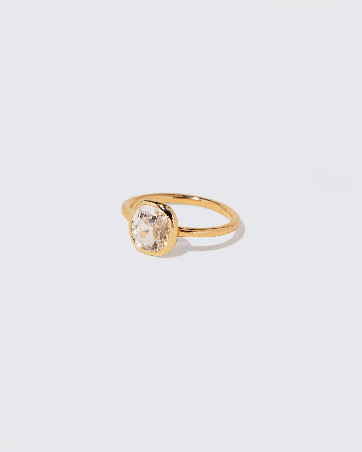 View from the side of the Gusher Diamond Ring 057 on light color background.