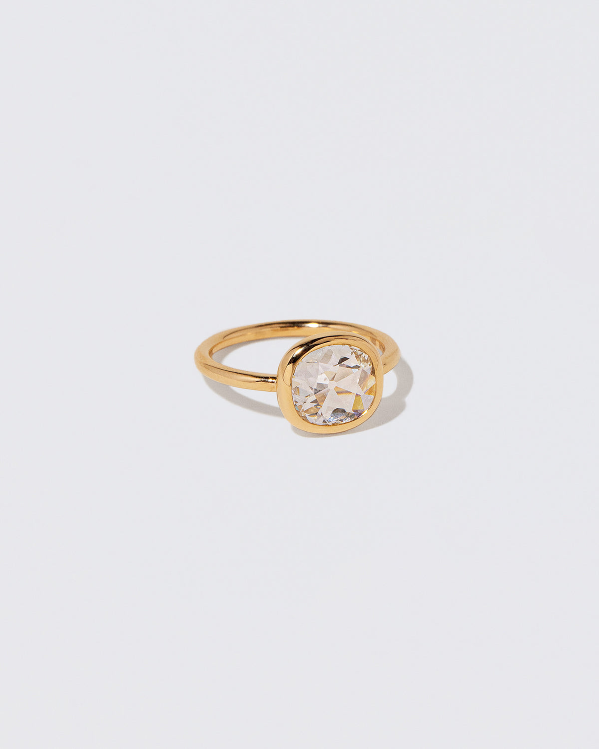 View from the side of the Gusher Diamond Ring 058 on light color background.