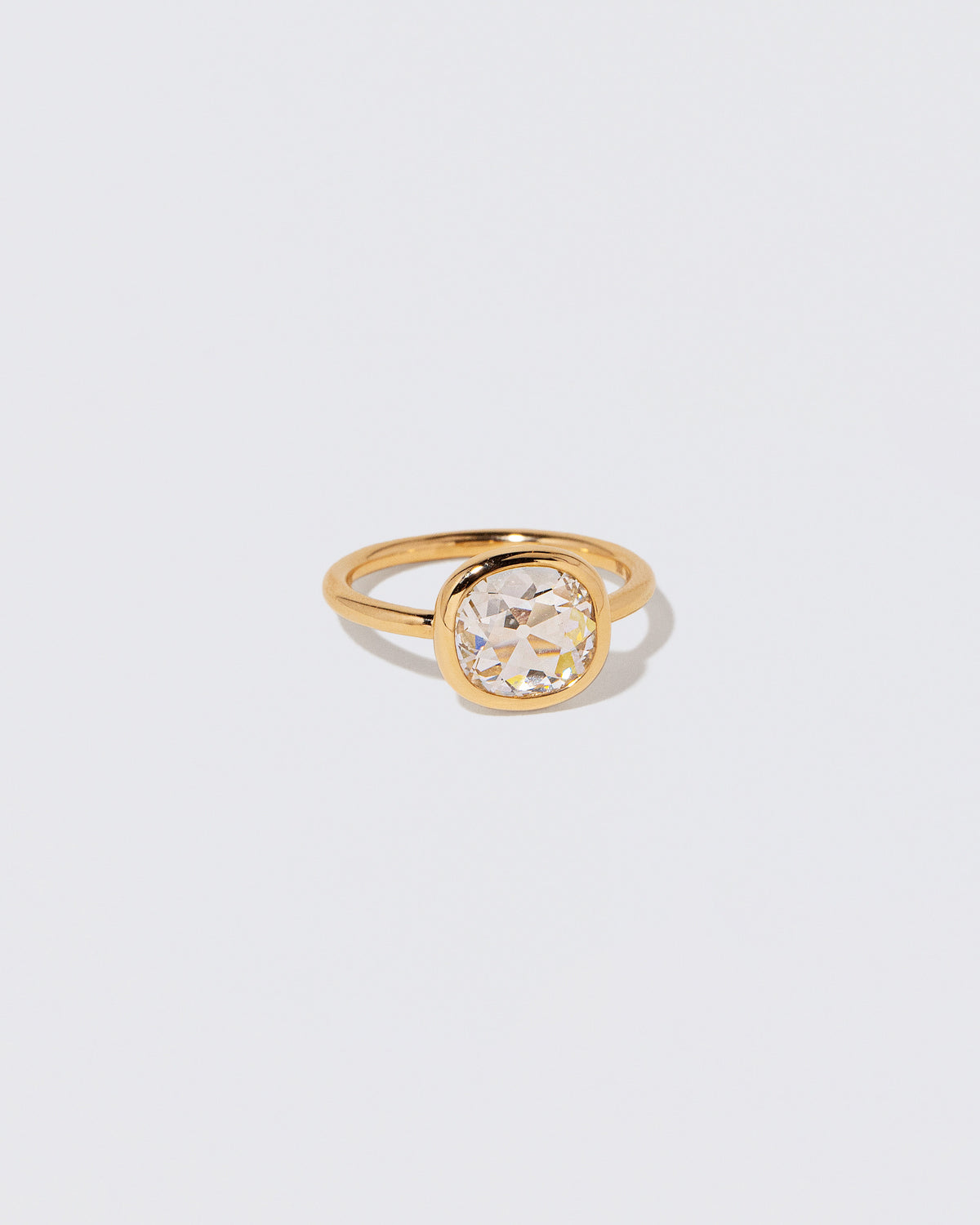 View from the side of the Gusher Diamond Ring 058 on light color background.