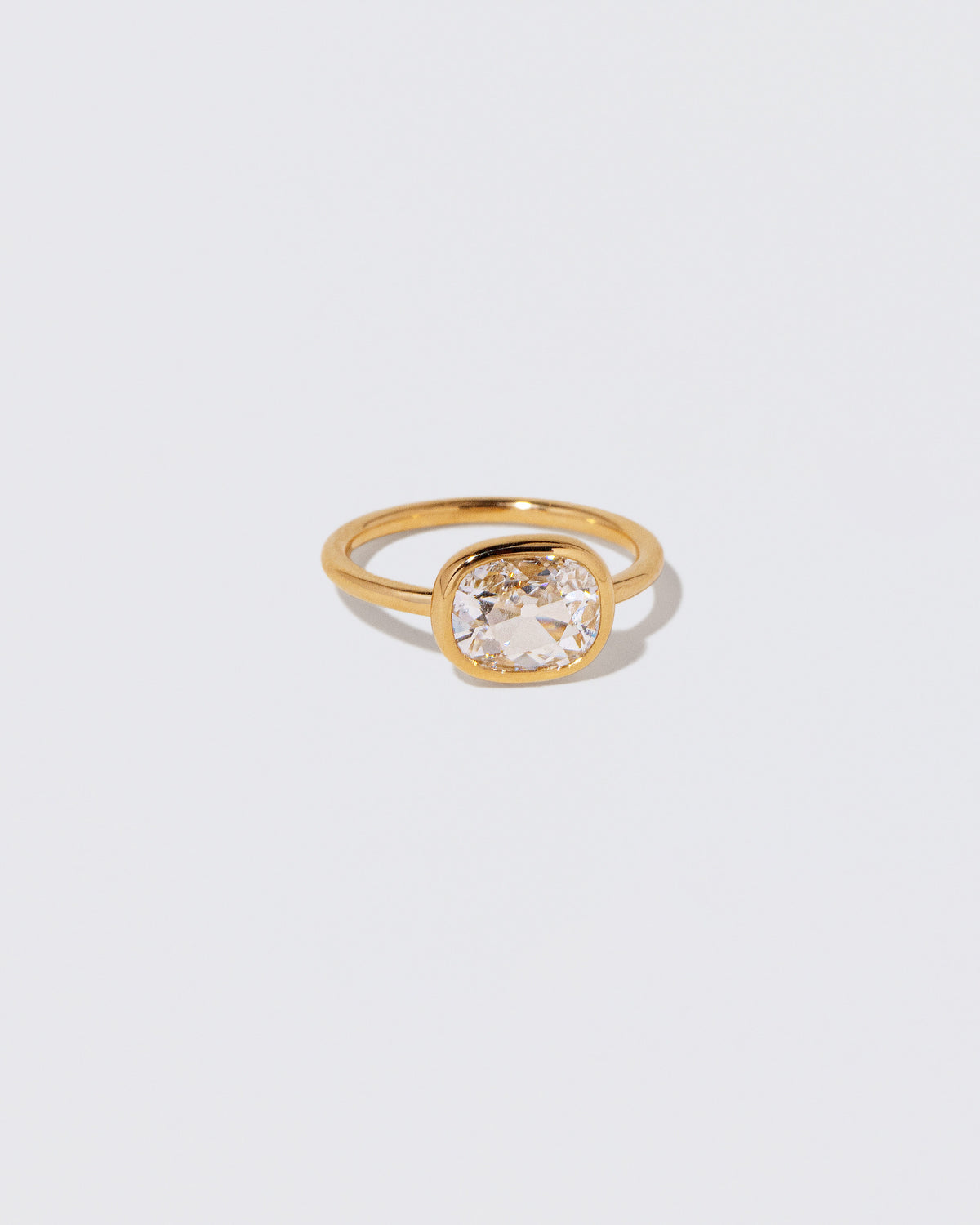 View from the side of the Gusher Diamond Ring 060 on light color background.