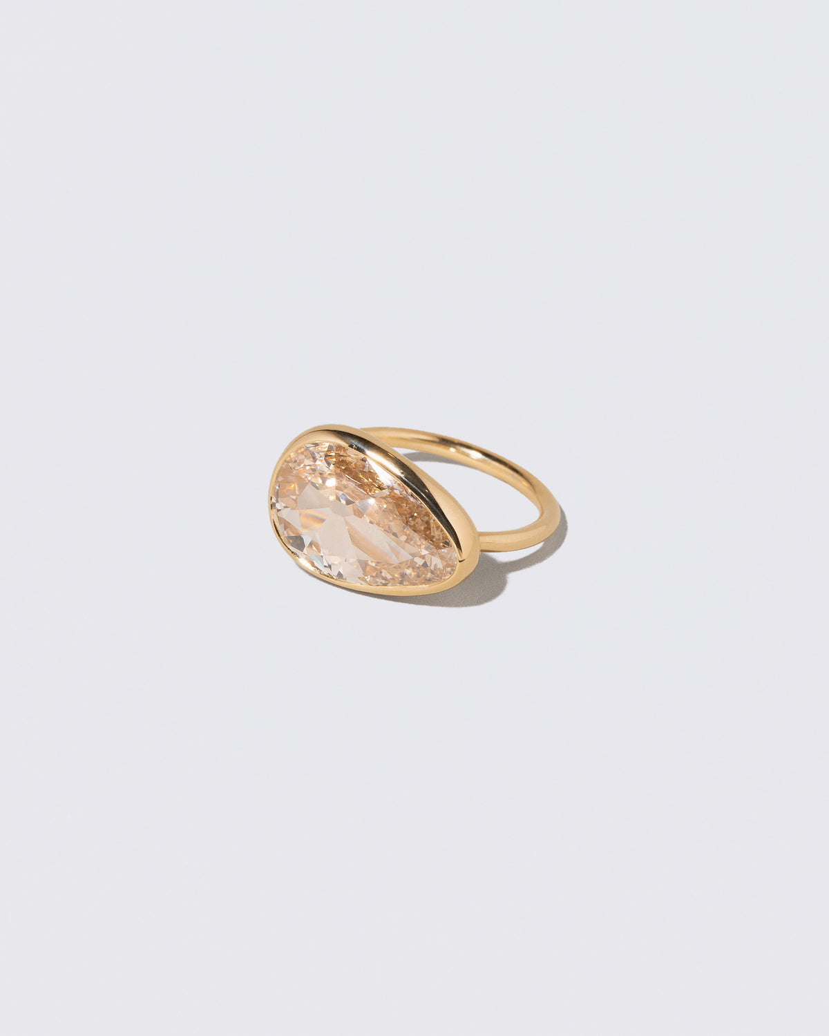 View from the side of the Gusher Diamond Ring 009 on light color background.