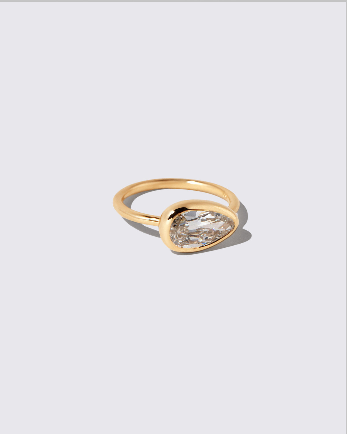 View from the side of the Gusher Diamond Ring 041 on light color background.