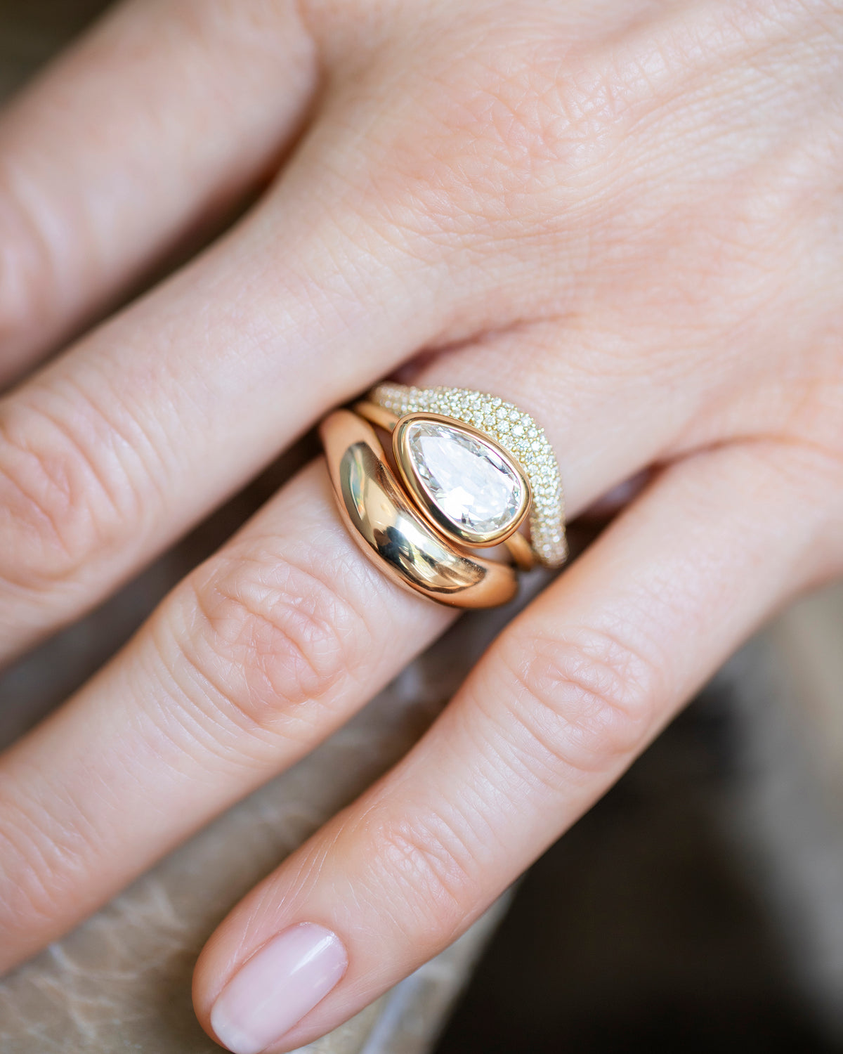 Gusher Diamond Ring 046, Gold Wide Level Band and Gold  Pavé Thin Level Band stack on model.