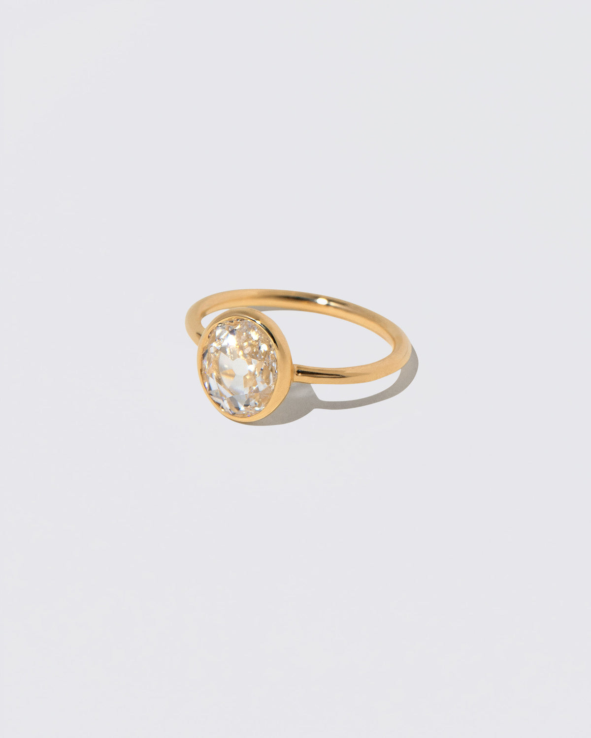 View from the side of the Gusher Diamond Ring 048 on light color background.