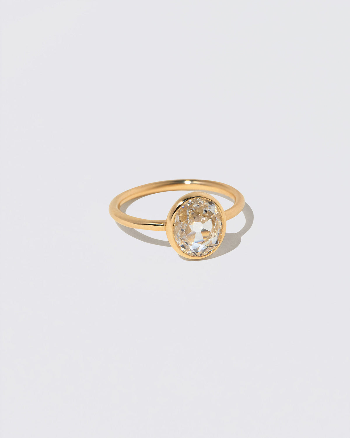 View from the side of the Gusher Diamond Ring 048 on light color background.