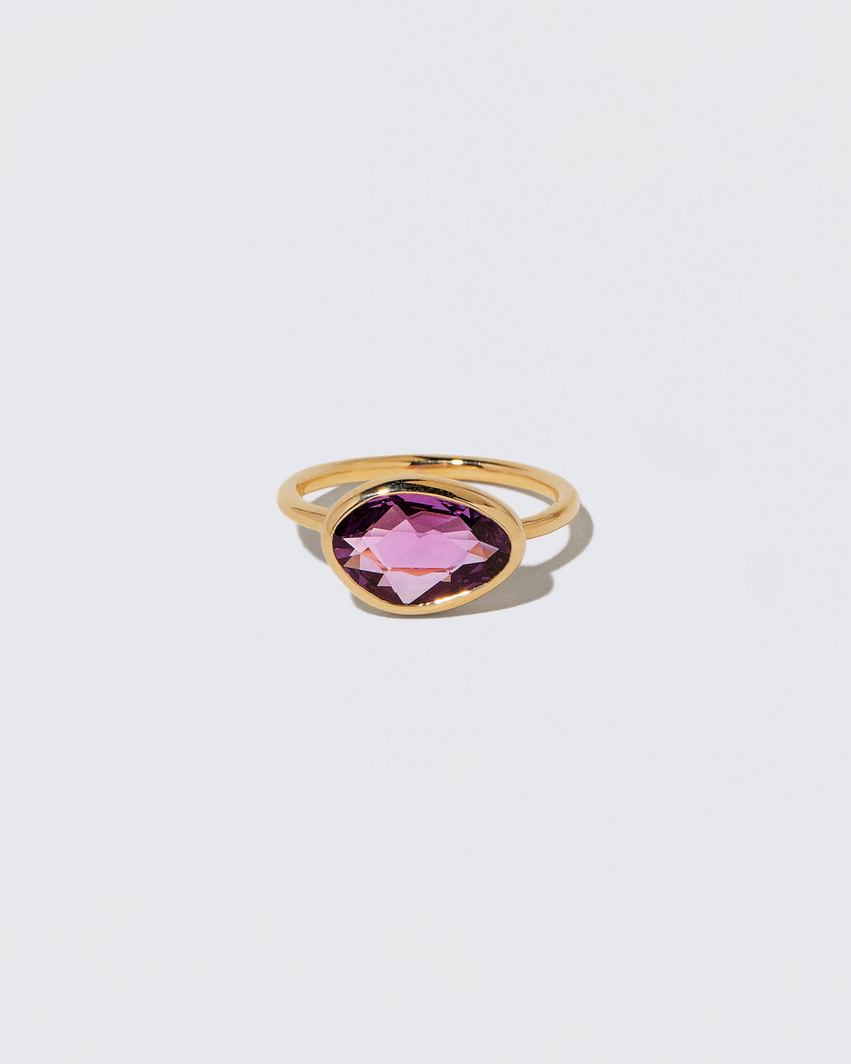 Gusher Pink Sapphire Ring 053 on light color background.