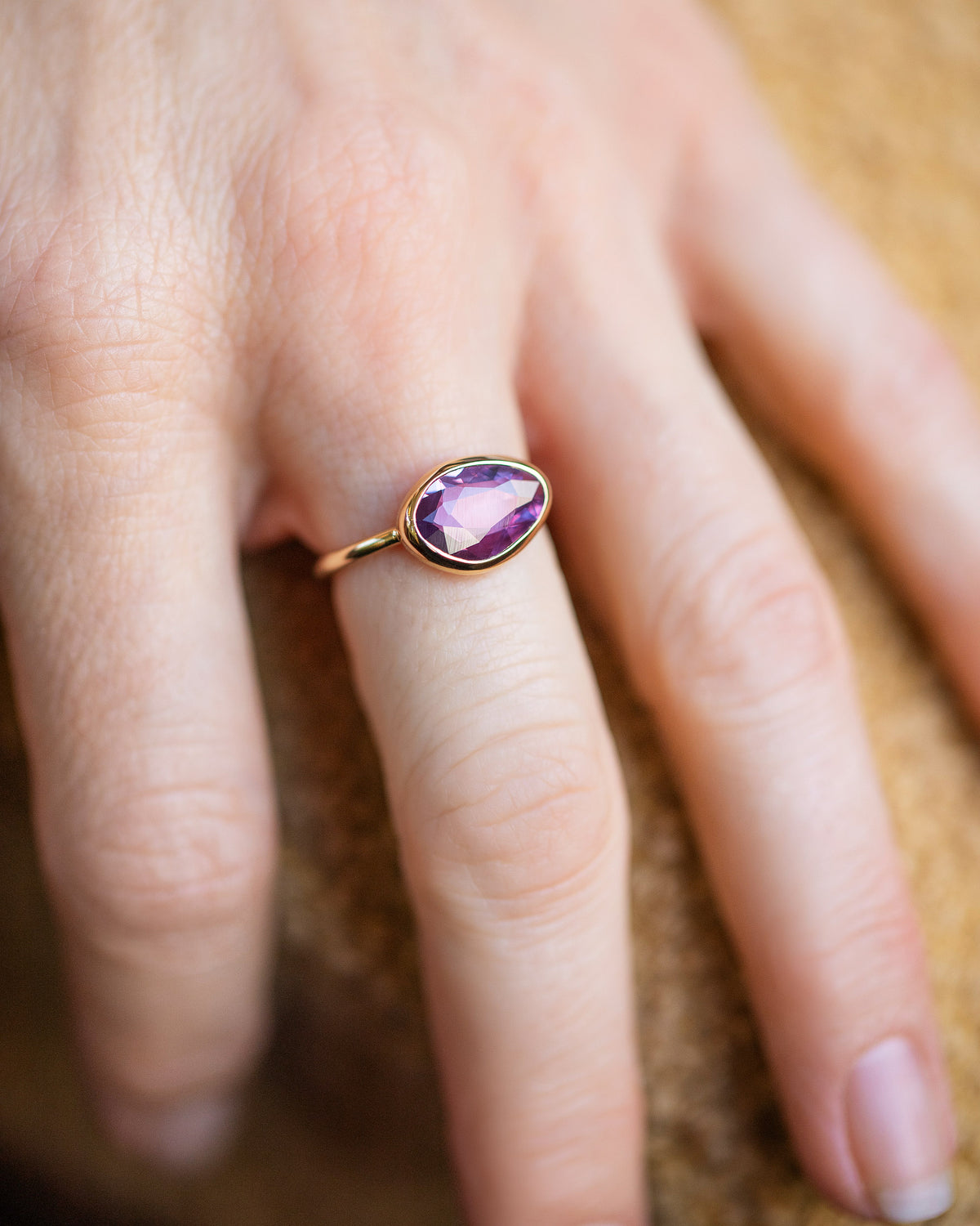 Gusher Pink Sapphire Ring 053 on model.