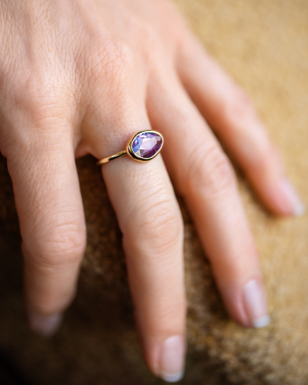 Gusher Pink Sapphire Ring 053 on model.
