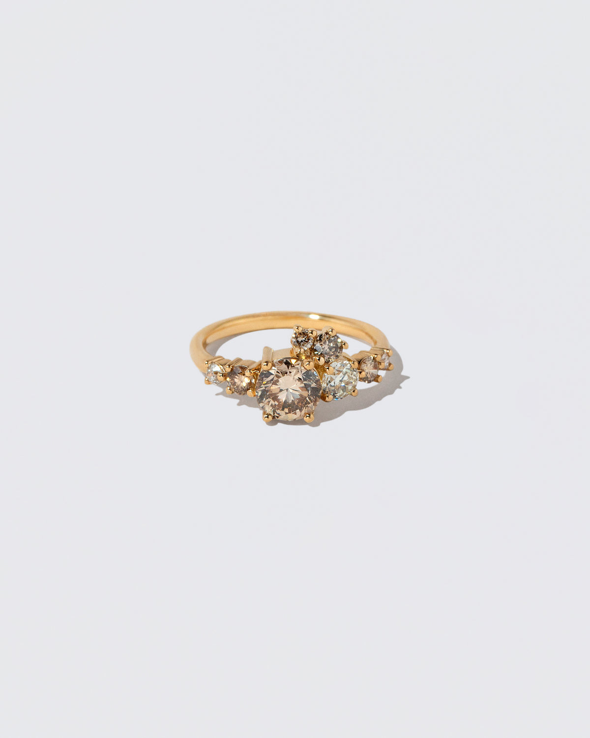 Champagne Diamond Luna Ring on light color background.