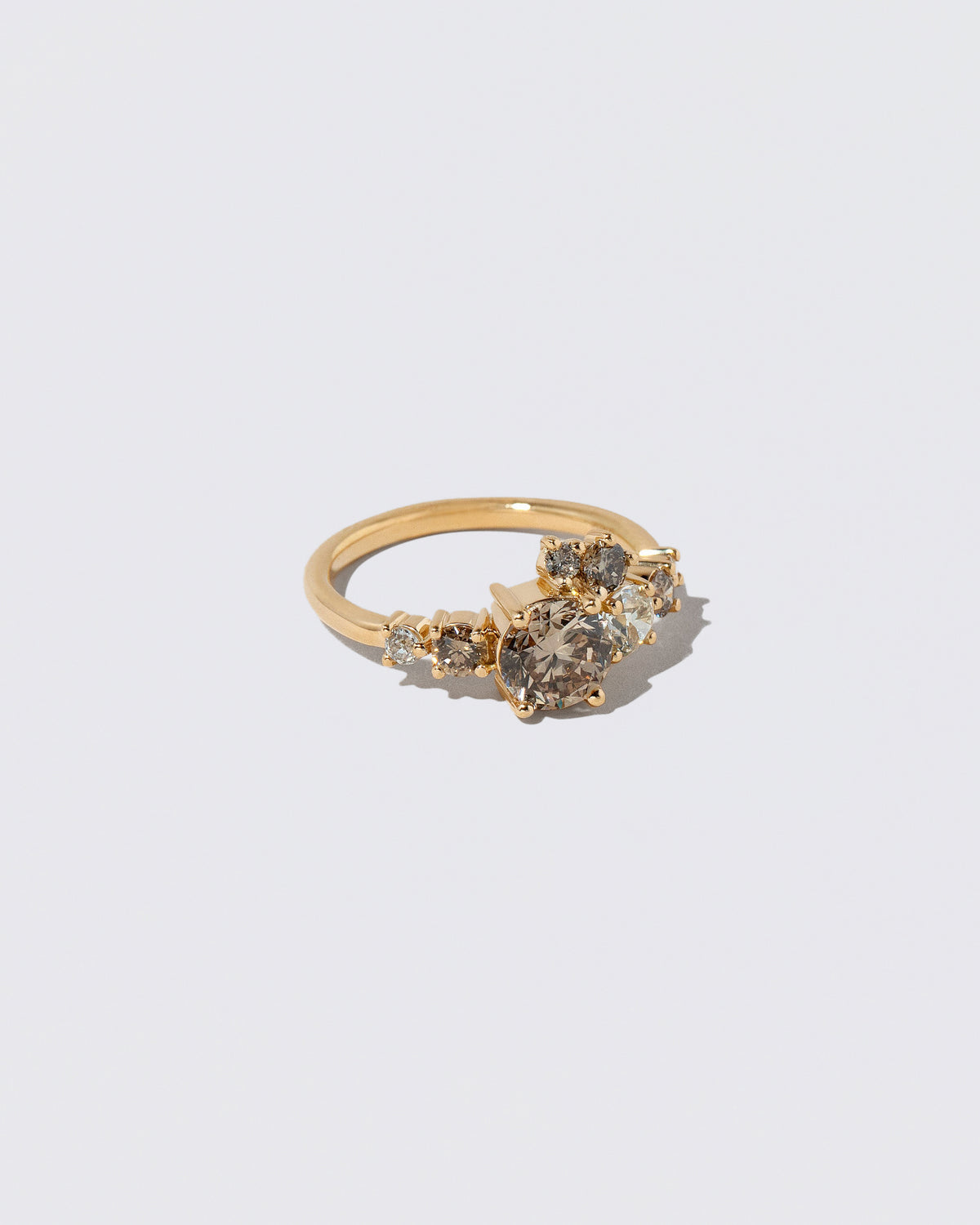 View from the side of the Champagne Diamond Luna Ring on light color background.
