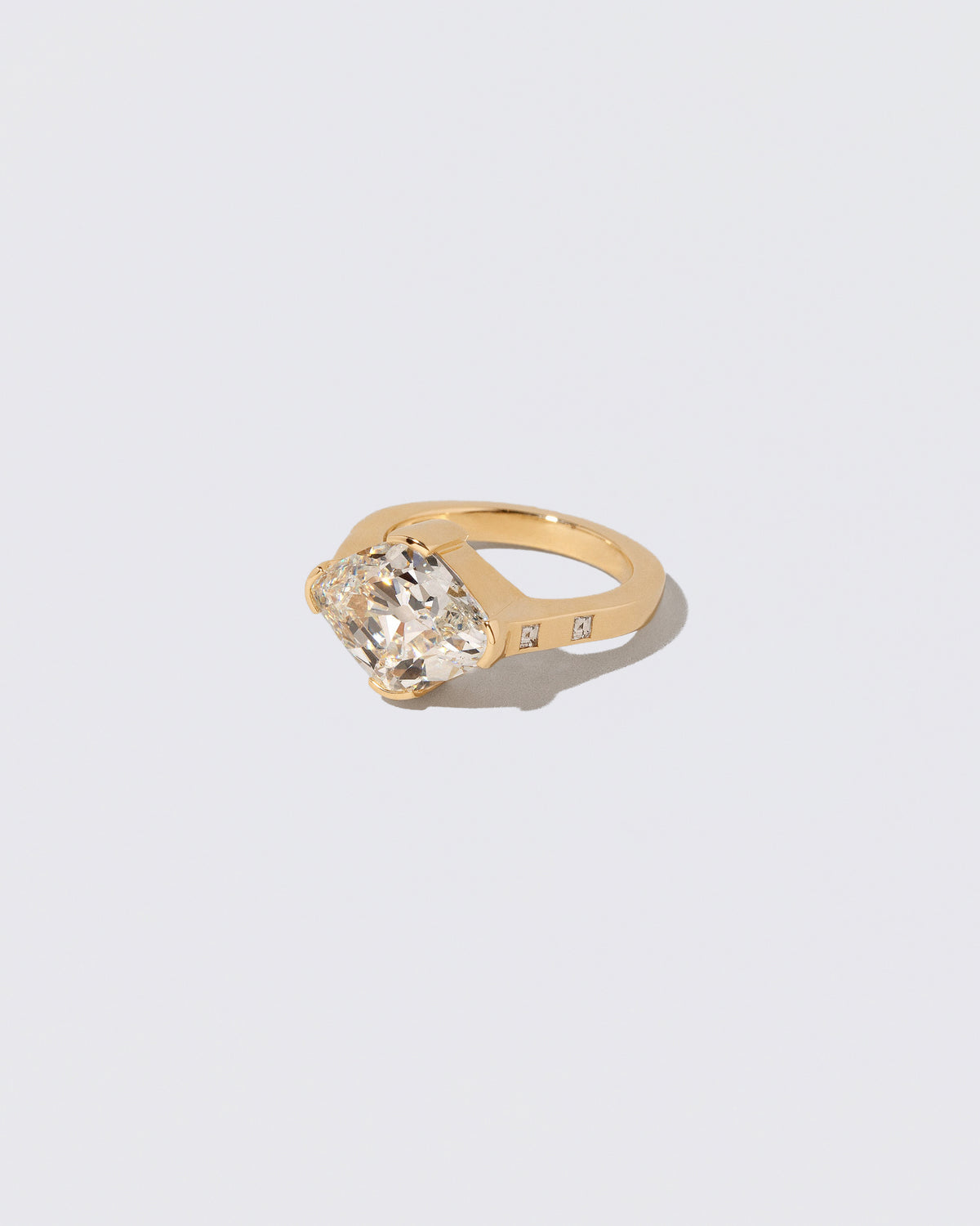 View from the side of the Narcissus Ring on light color background.