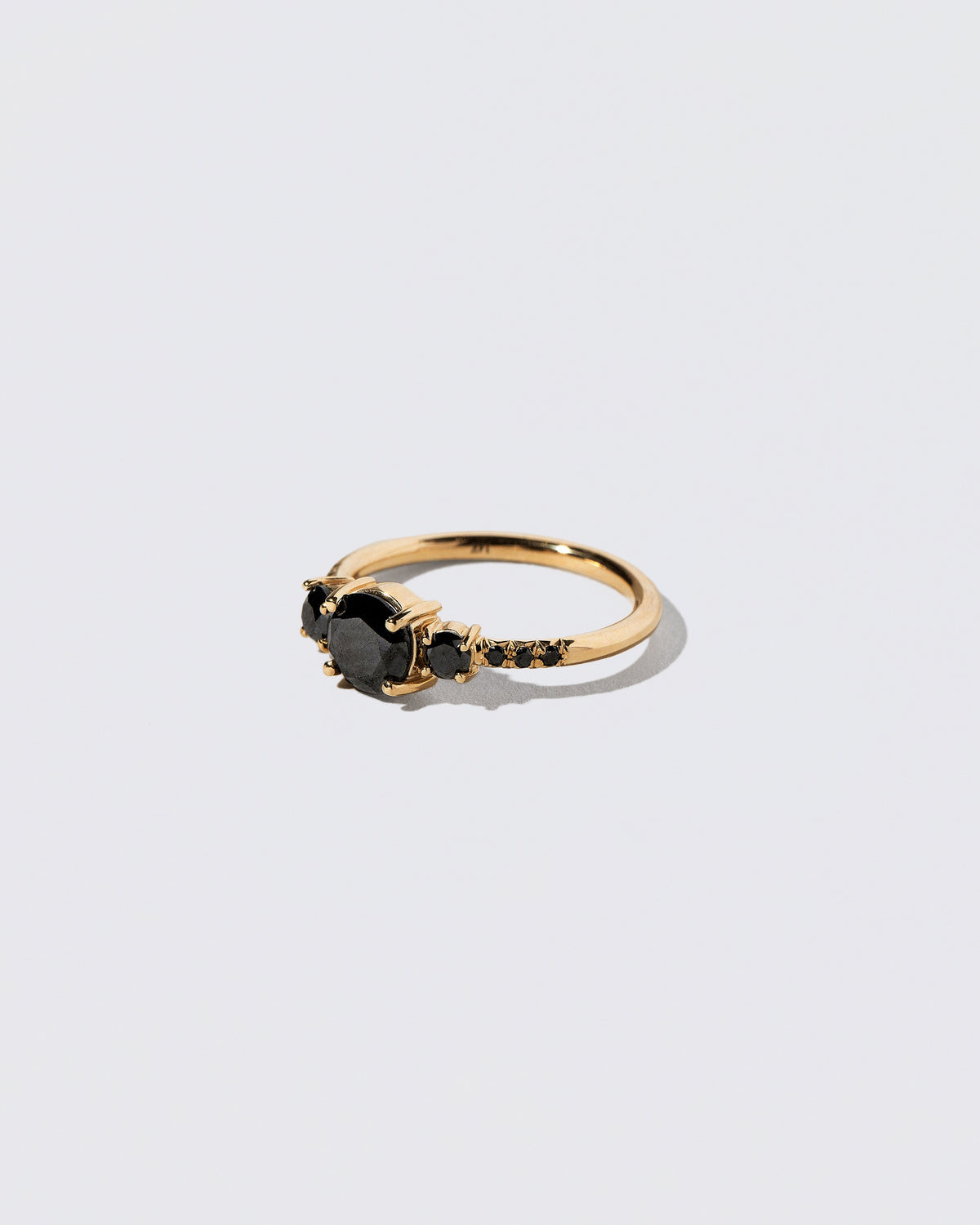 View from the side of the Black Diamond Orion Ring on light color background.