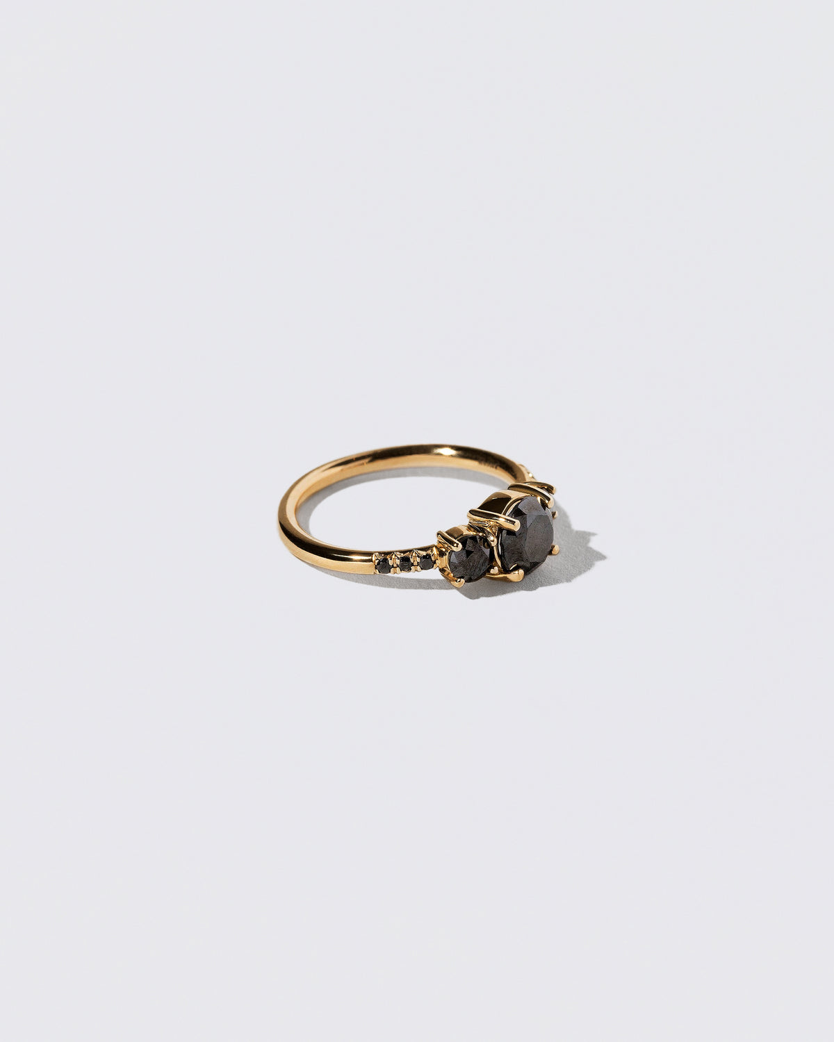 View from the side of the Black Diamond Orion Ring on light color background.