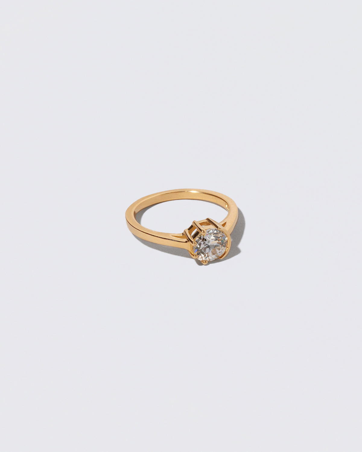 View from the side of the White Diamond Sun & Moon Ring on light color background.
