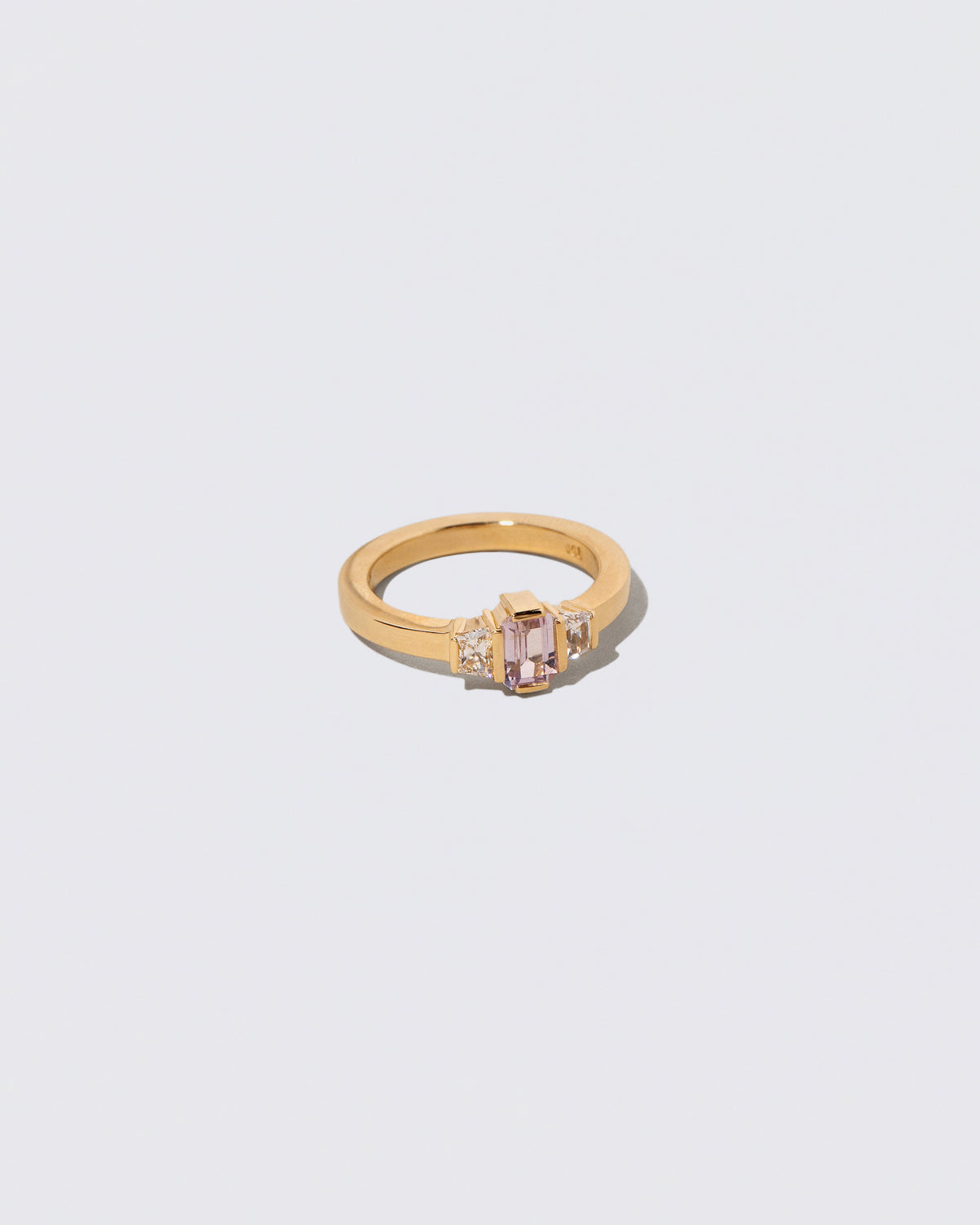 View from the side of the Sweetheart Ring on light color background.