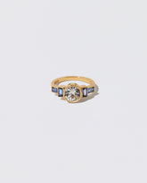 White Diamond & Blue Sapphire Third Eye Ring on light color background.