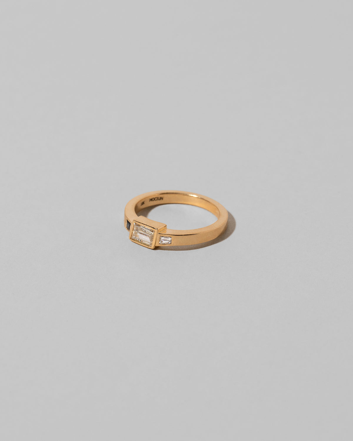 View from the side of the This Way Ring on light color background.