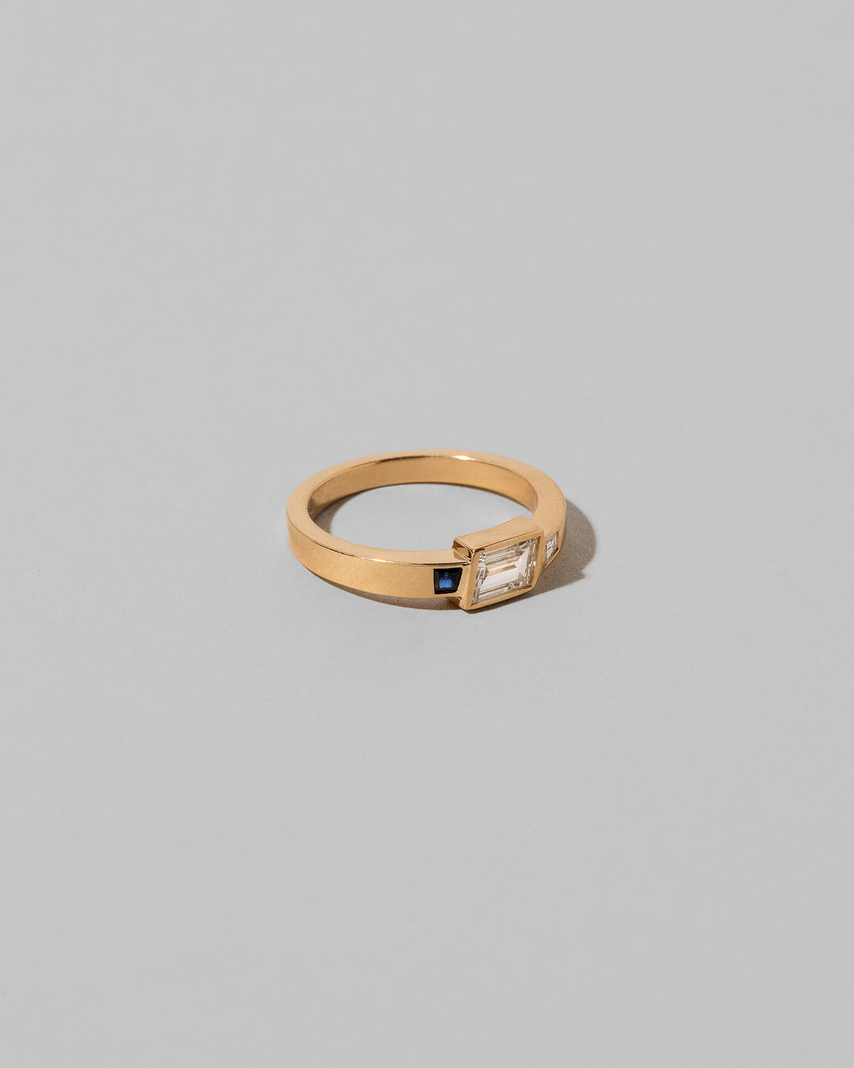 Closeup details of the This Way Ring on light color background.