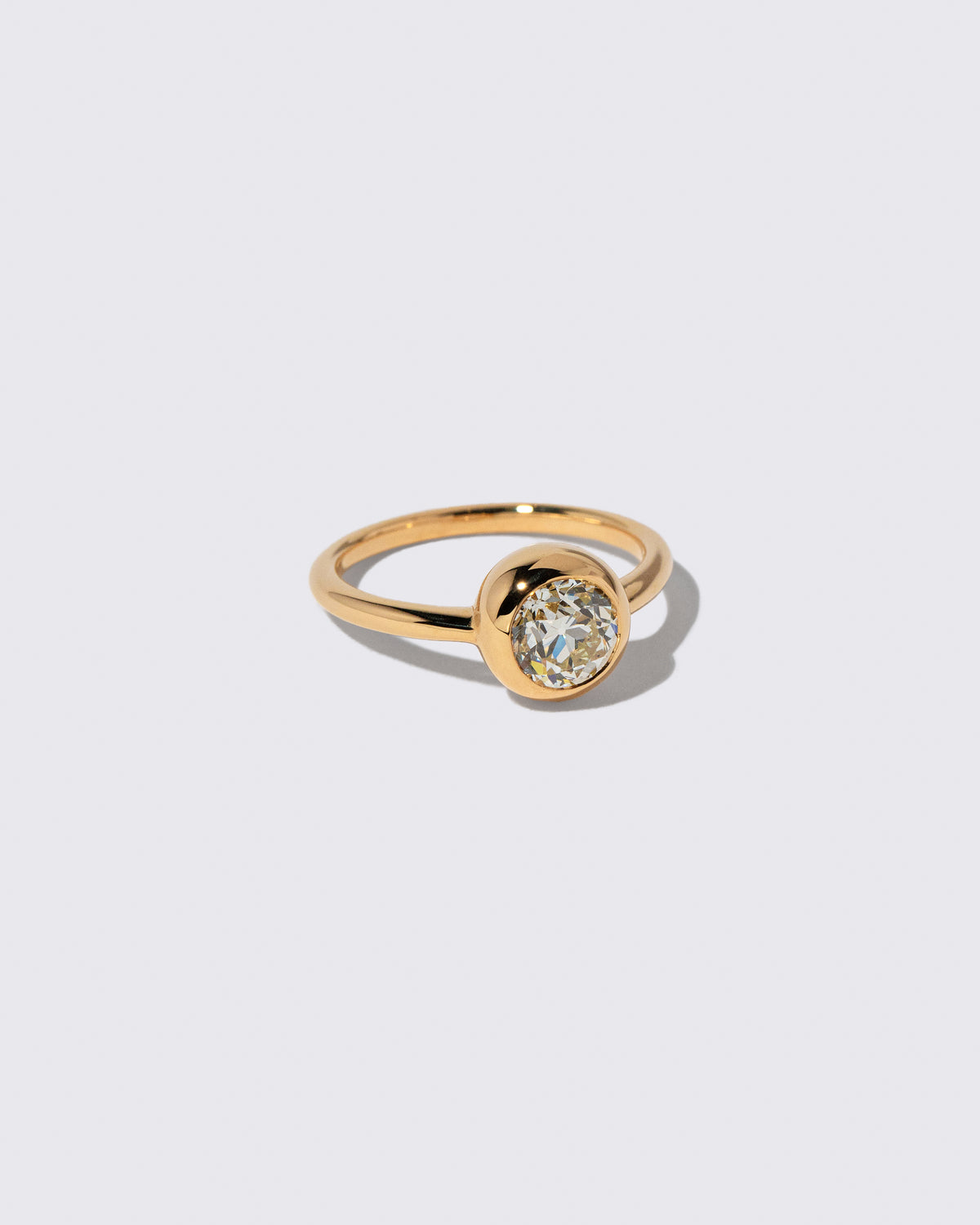 View from the side of the Diamond Wellspring Ring on light color background.