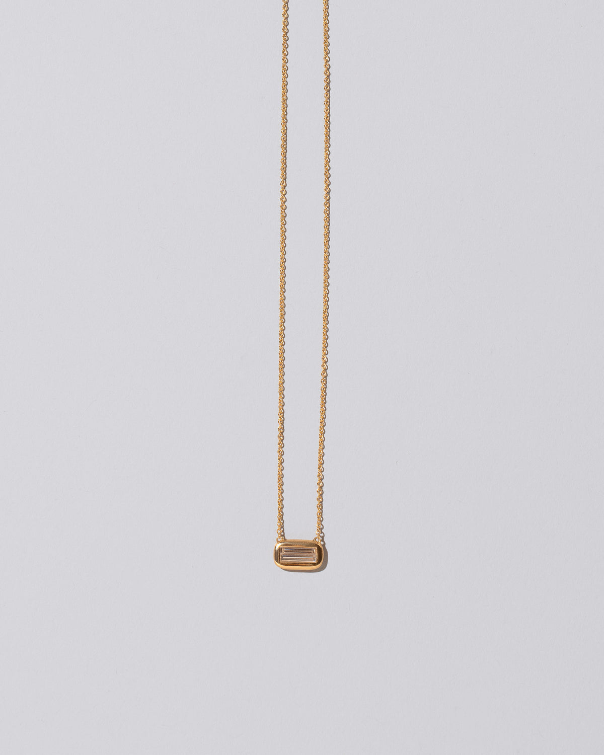 Shah Necklace on light color background.