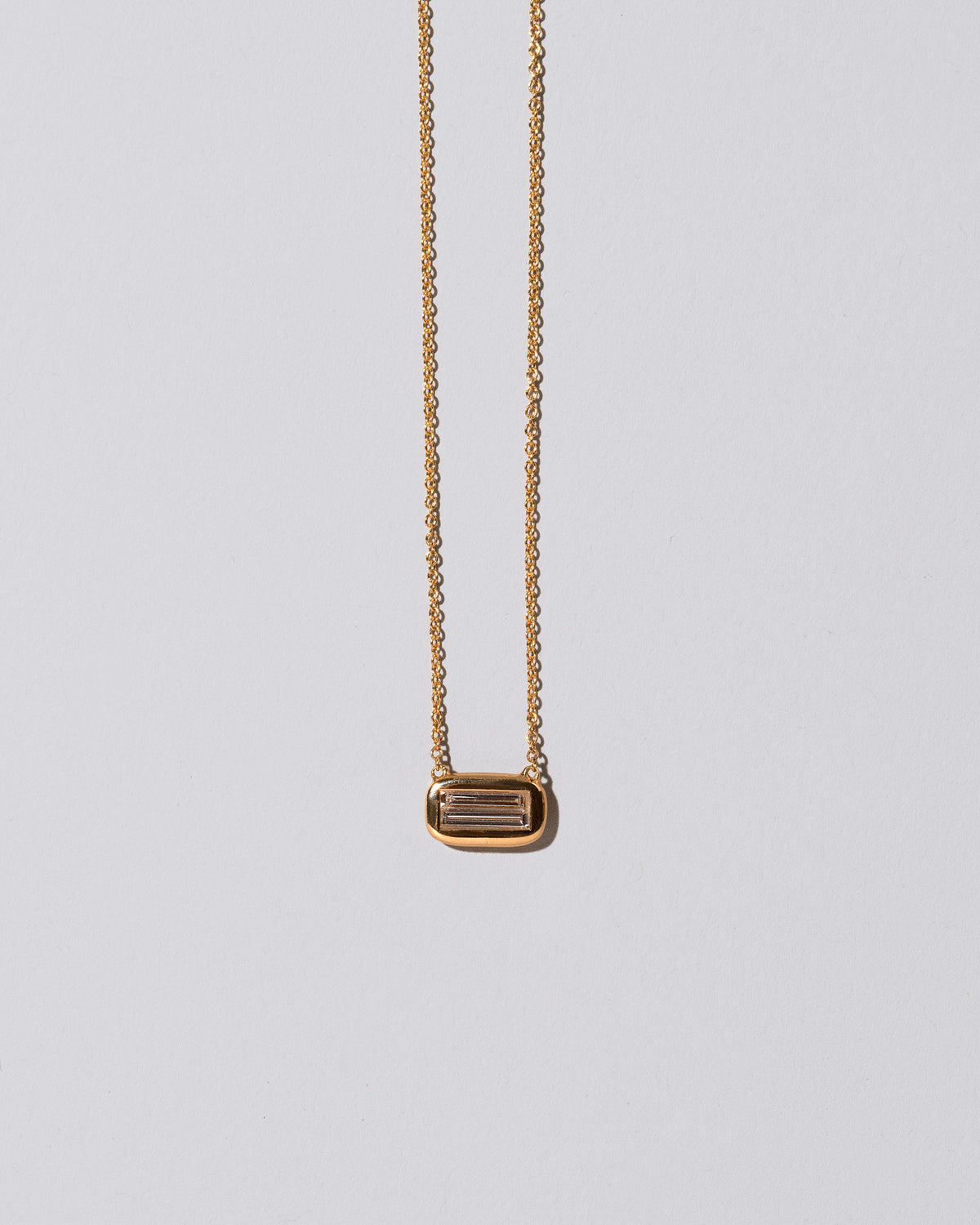 Closeup details of the Shah Necklace on light color background.