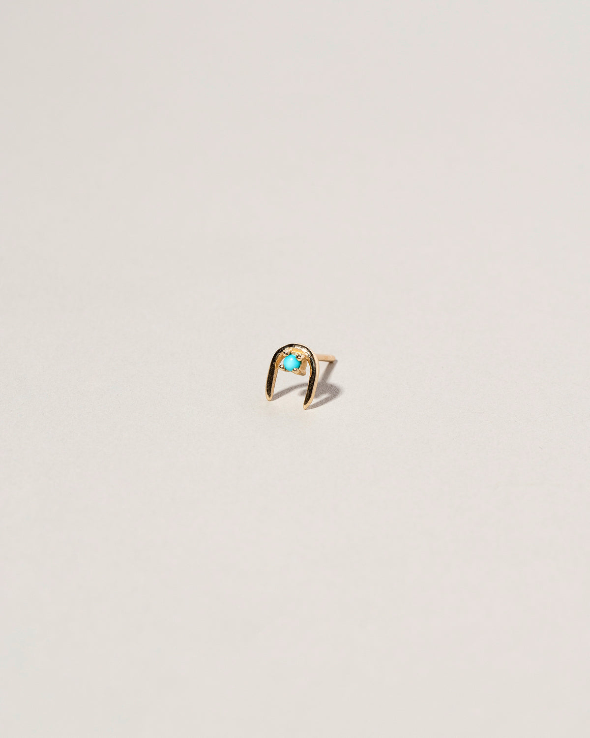 Turquoise Moon Catcher Stud Earring Single on light color background.