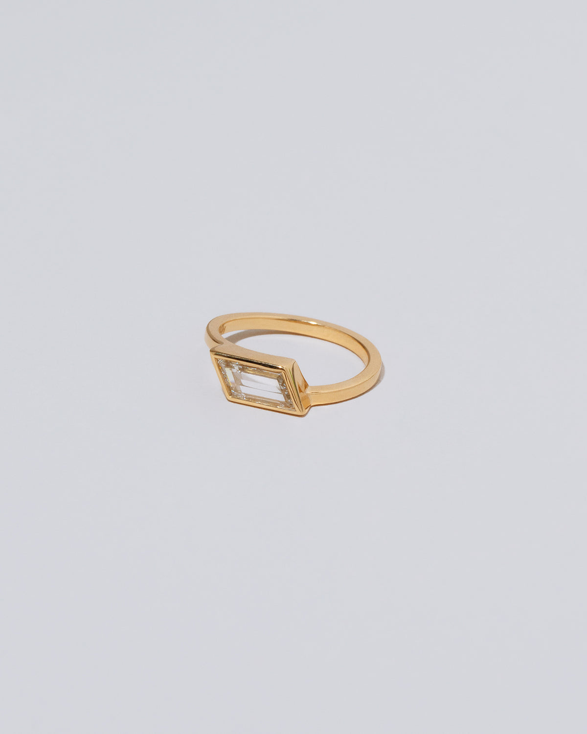 View from the side of the Soutenu Ring on light color background.