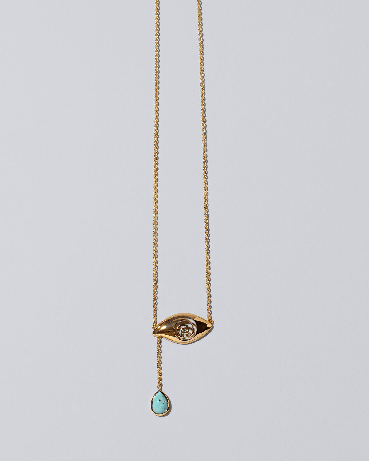 Turquoise State Shifter Necklace on light color background.