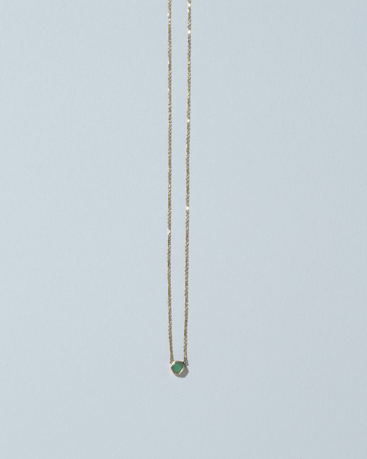 Variscite Hexagon Necklace on light color background.