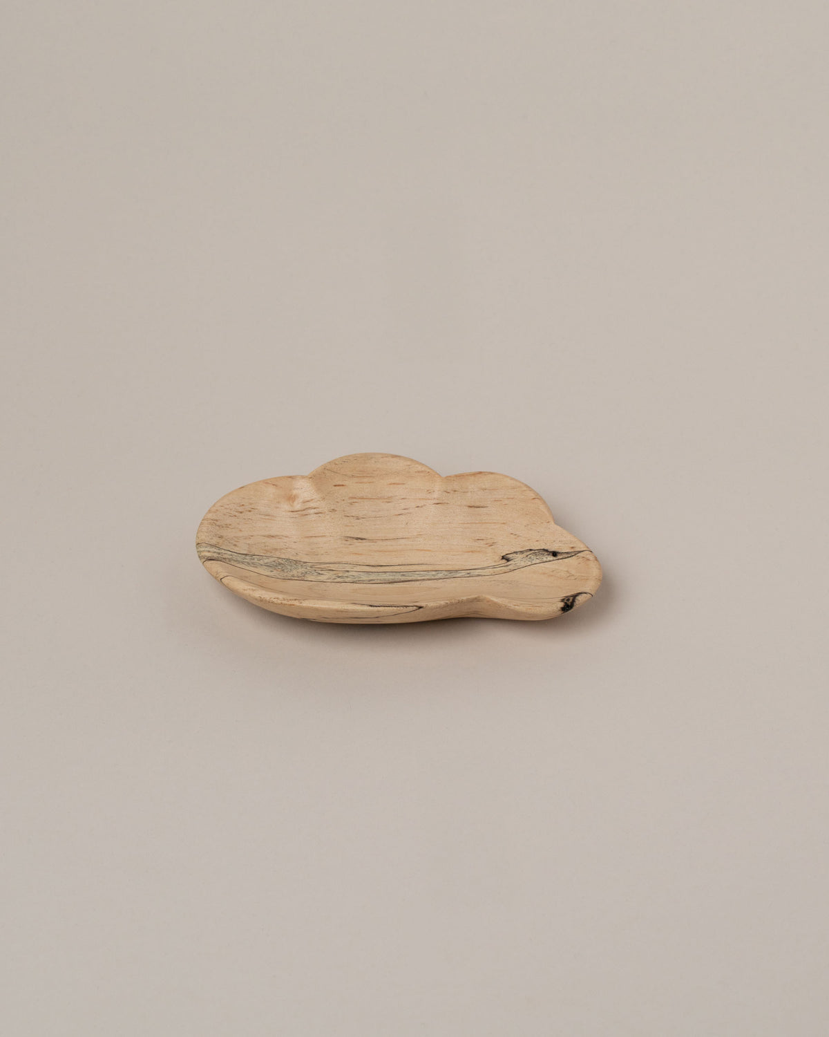 Namu Home Goods One Cloud Plate on light color background.