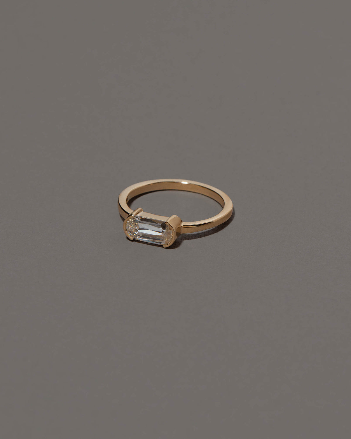 View from the side of the Conviviality Ring on grey color background.