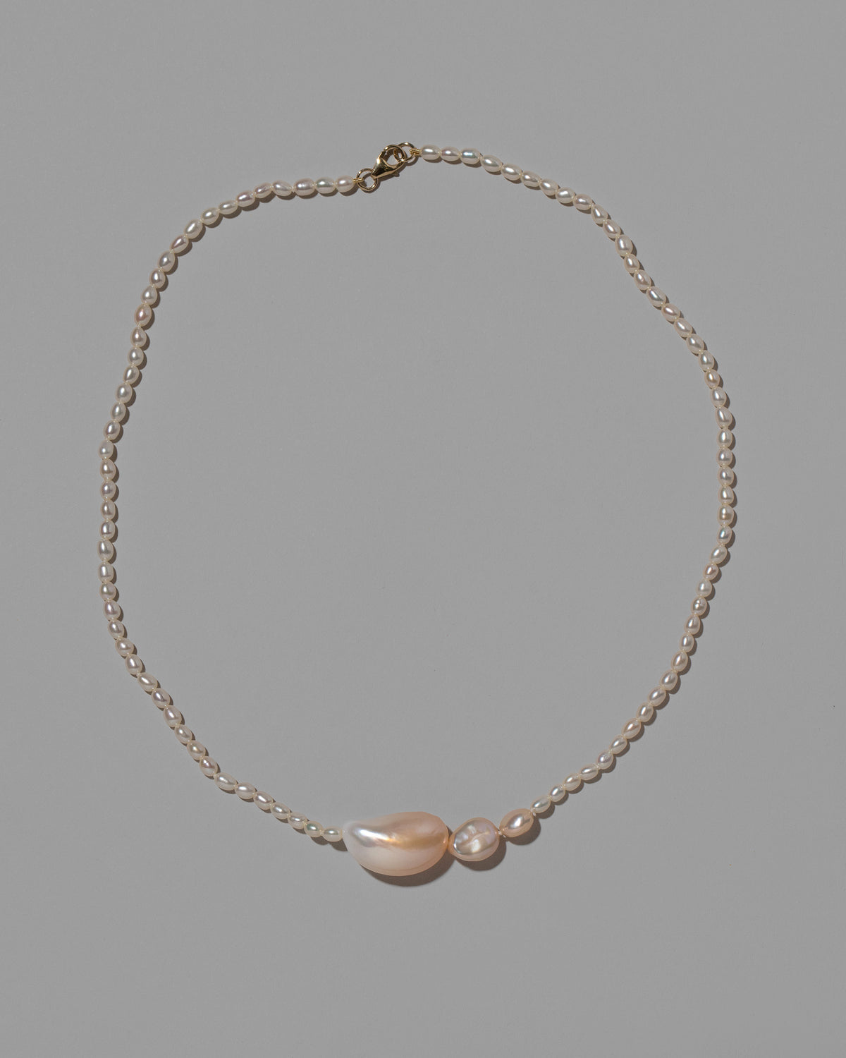 Nereus Pearl Necklace on light color background.
