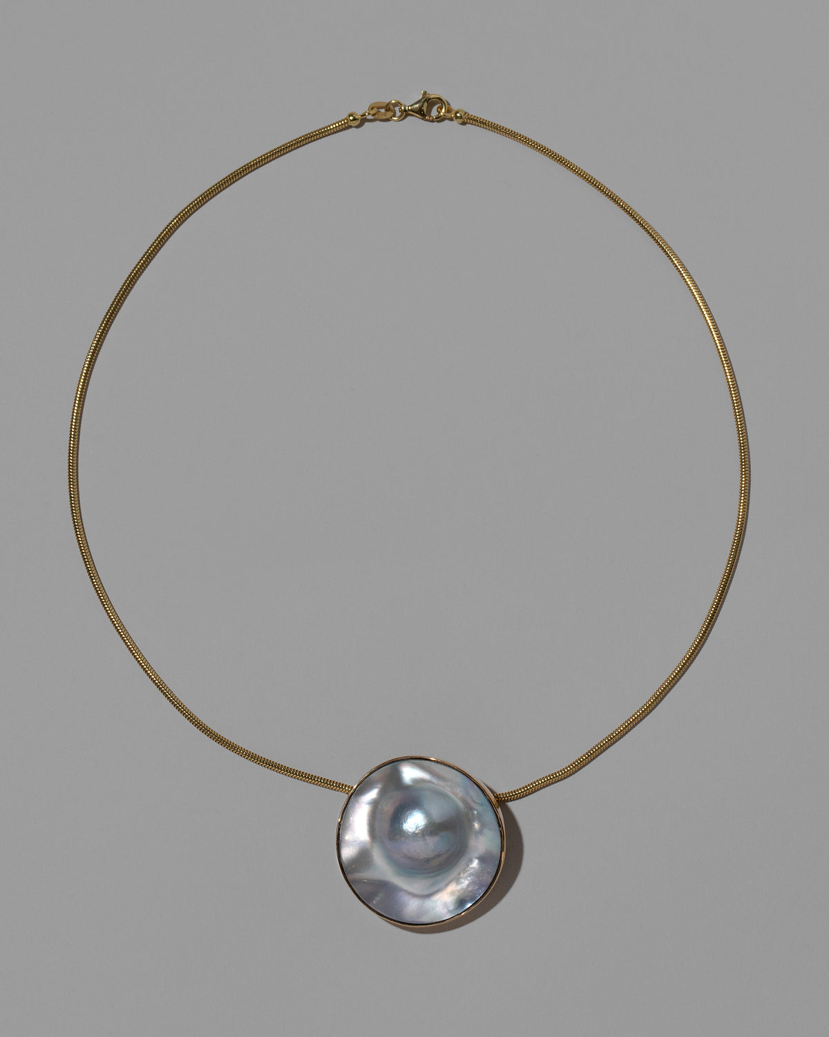 Seeing the Unseen Necklace on light color background.
