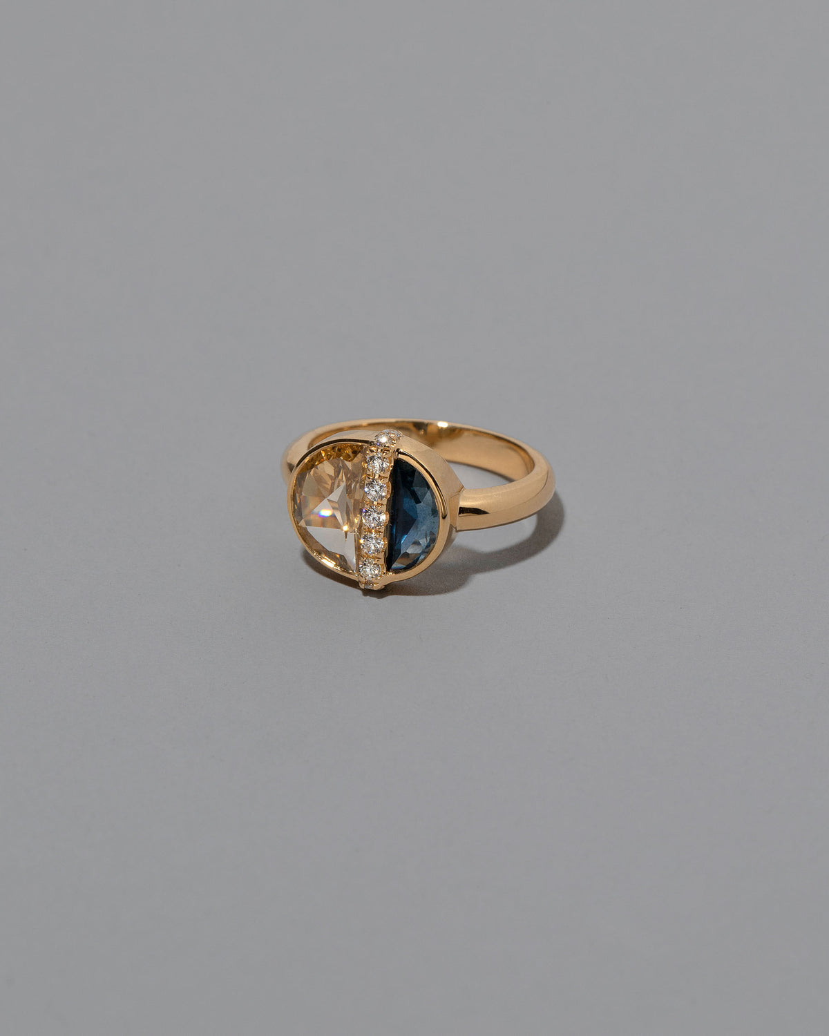 View from the side of the Opulence Ring on light color background.