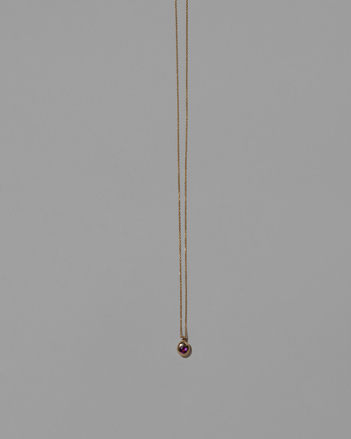 Amethyst Birthstone Level Necklace on light color background.