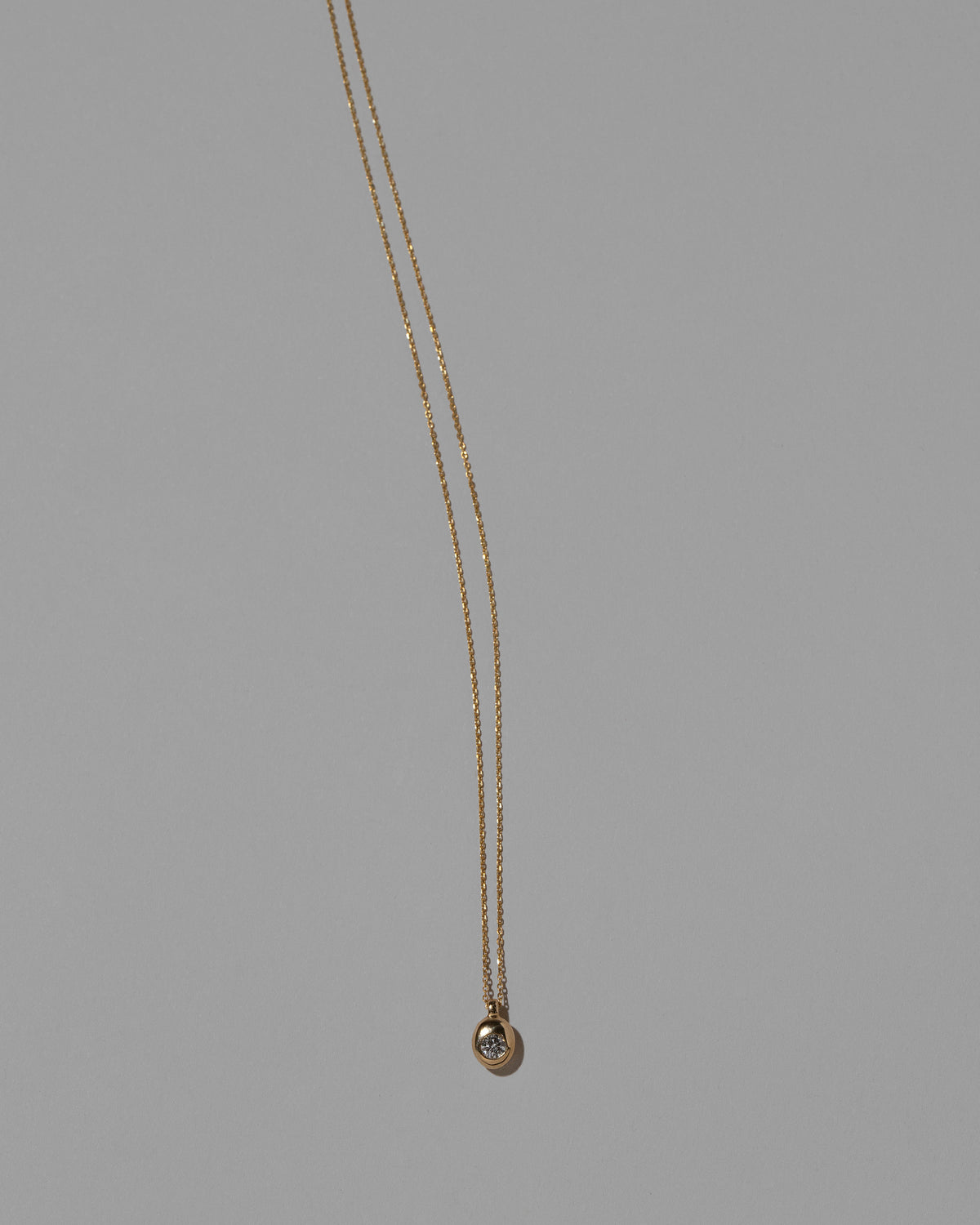 Diamond Birthstone Level Necklace on light color background.