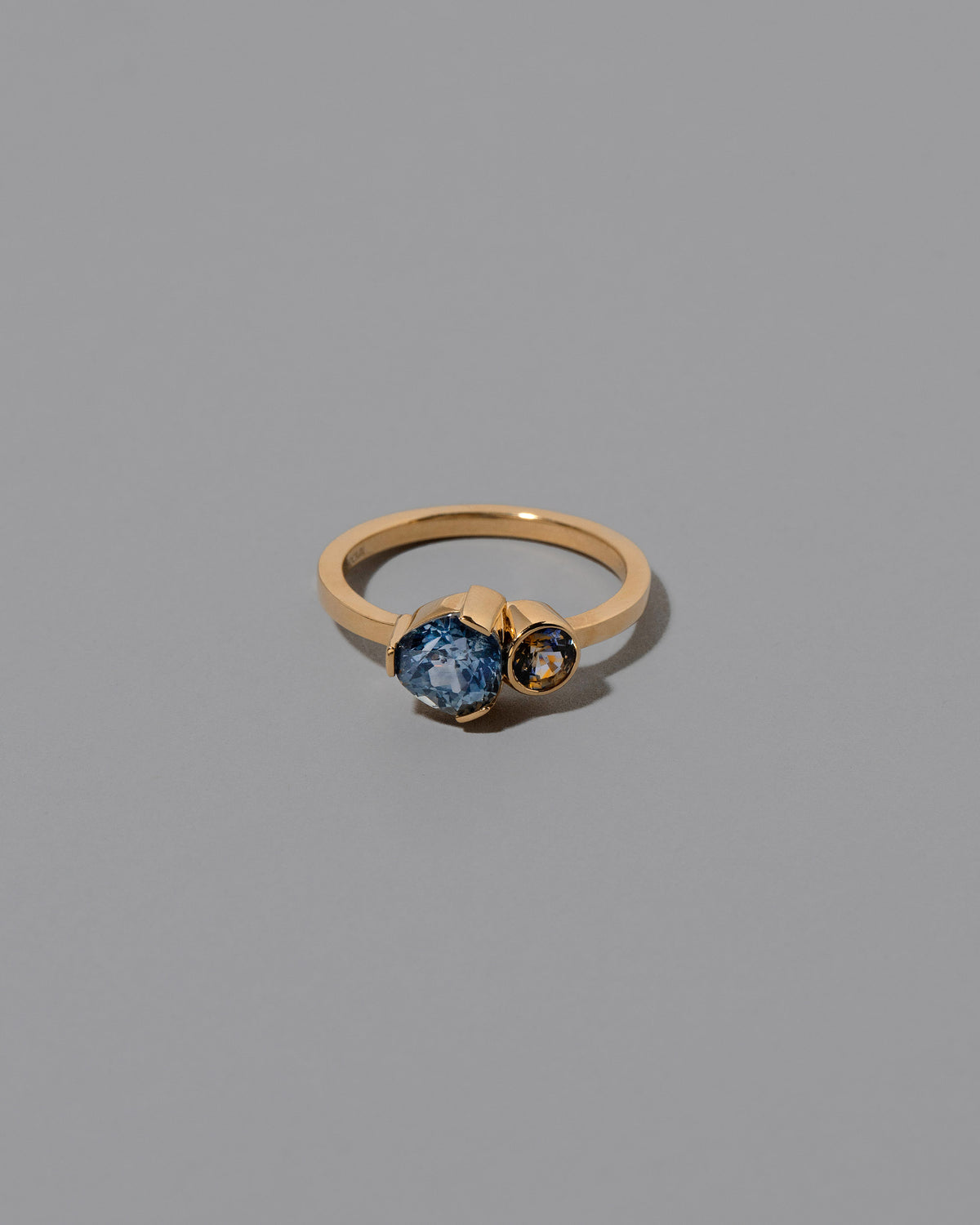 Plenitude Ring on light color background.