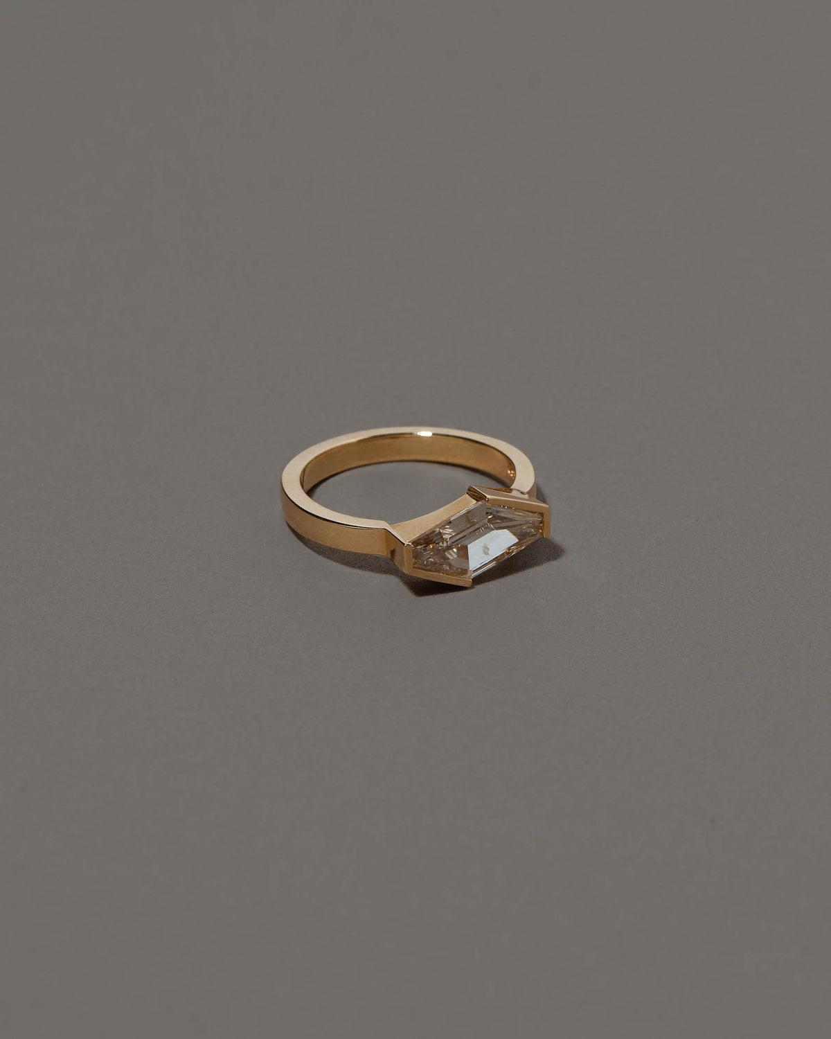 View from the side of the Mirth Ring on grey color background.