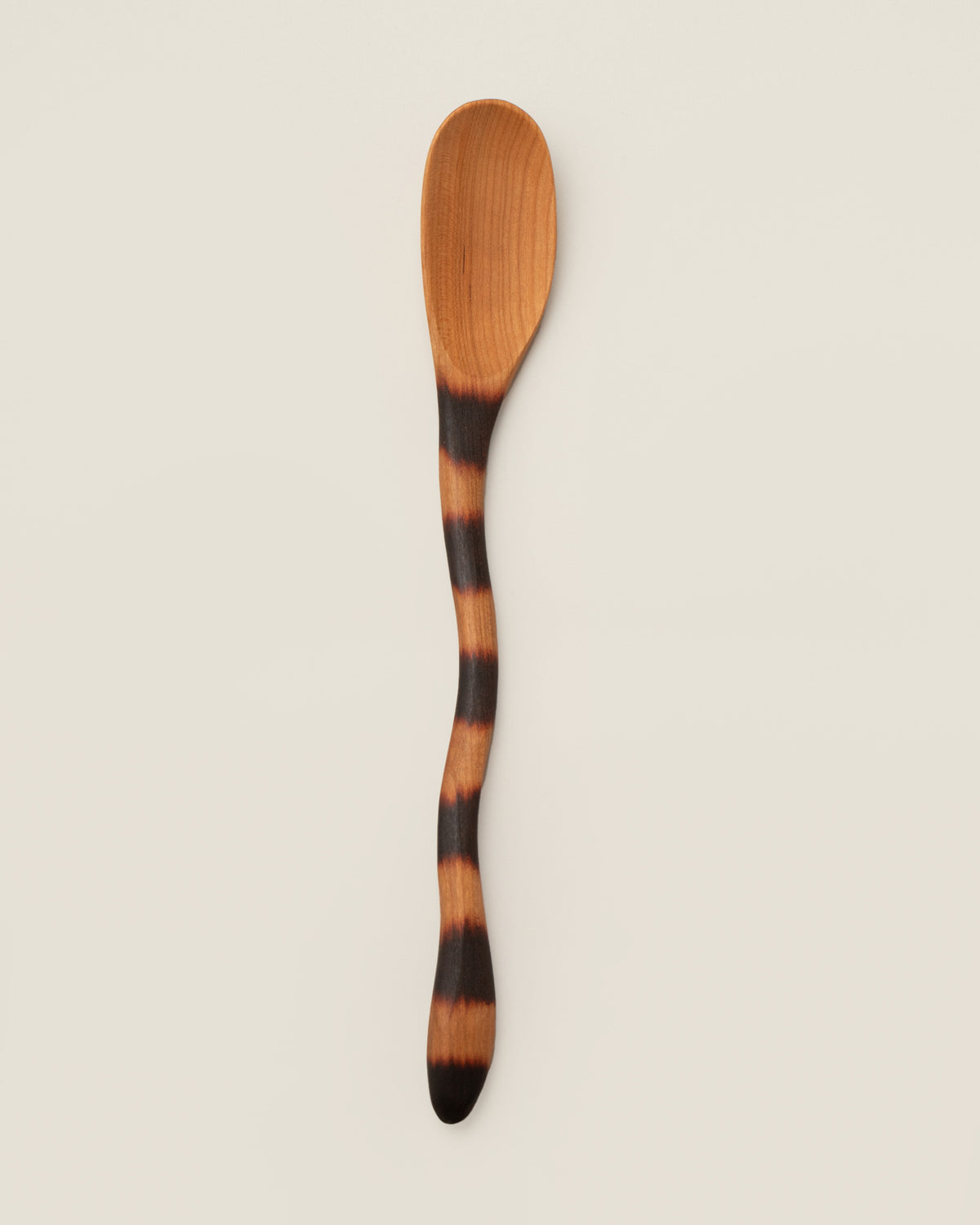Jonathan's Spoons Cat Tail Spoon on light color background.